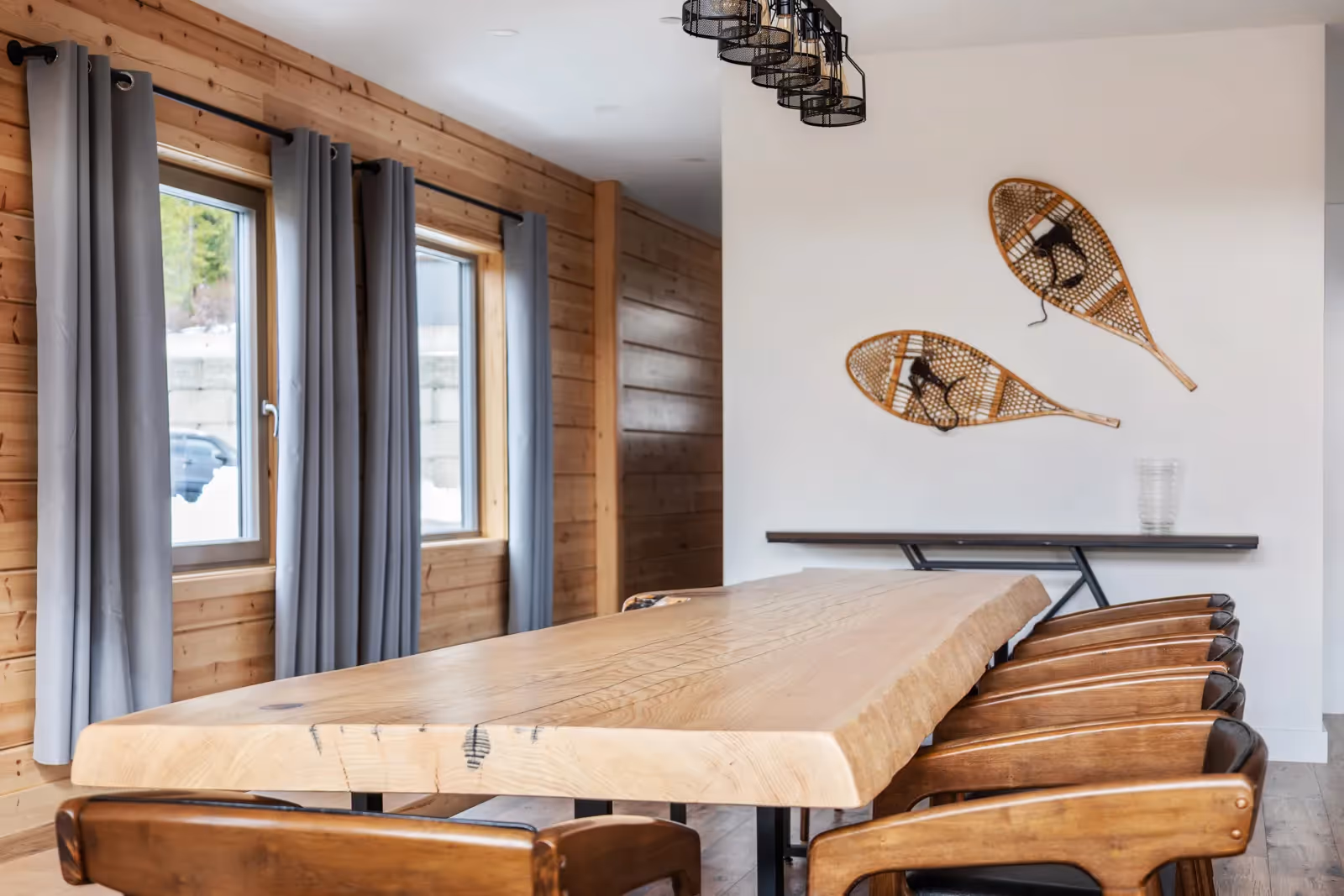 Multi-deck outdoor space at Fjellheim with storage for outdoor gear and mountain ridge views