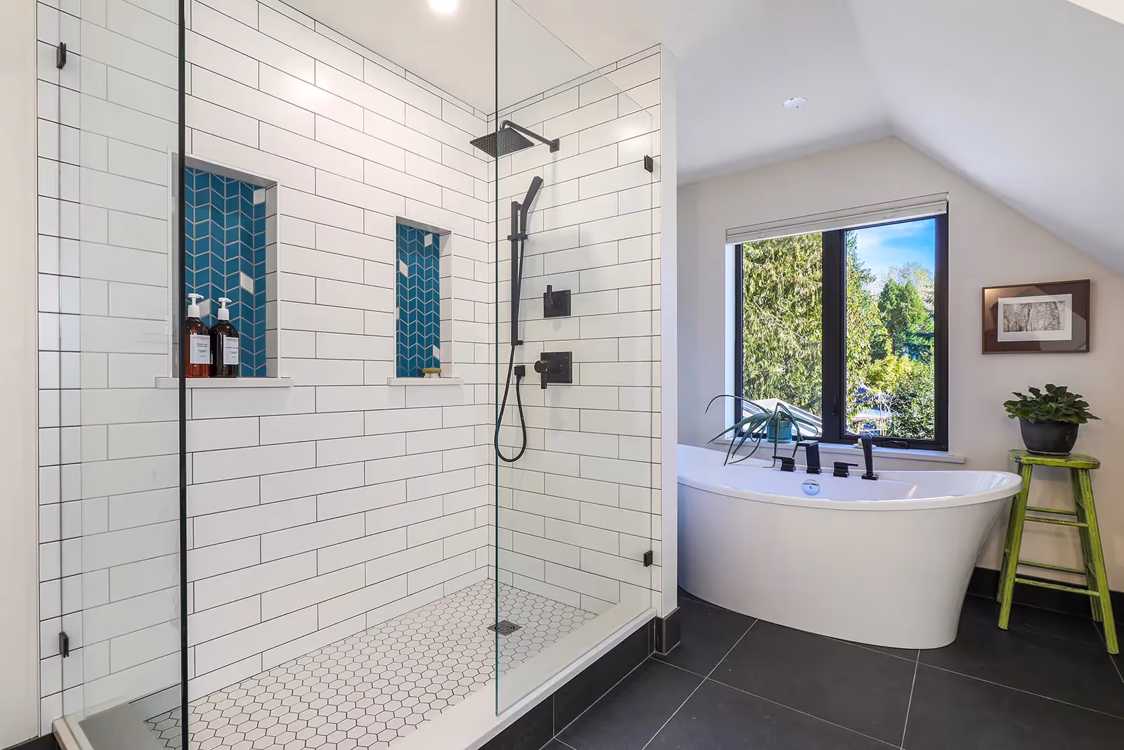Magazine-worthy spa bathroom in Rustic Retreat with freestanding tub, glass shower, and chevron tile shelving