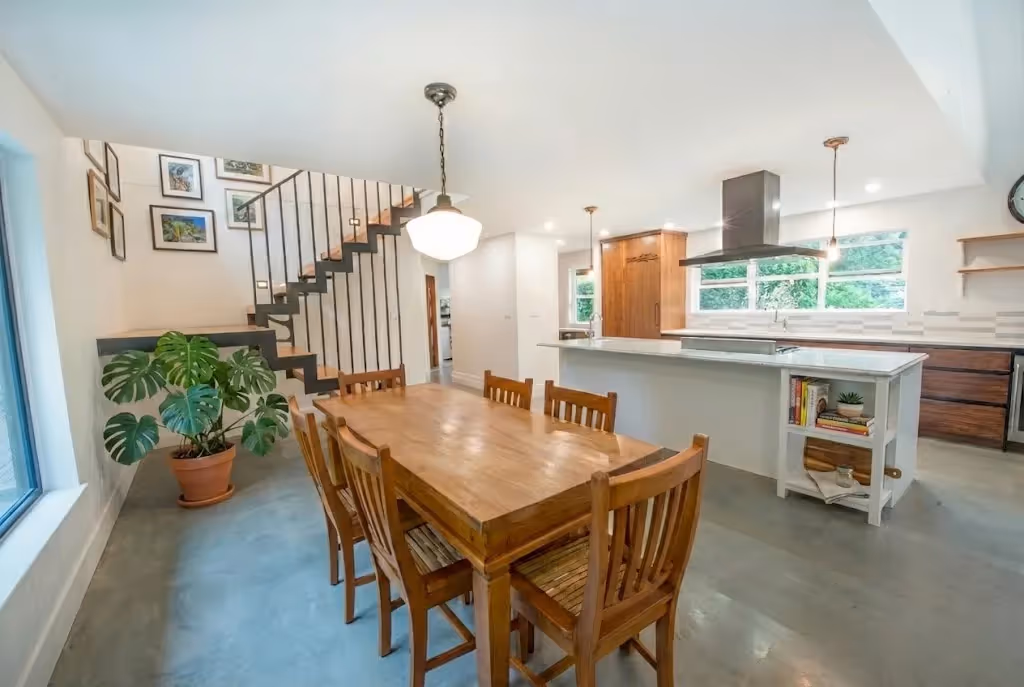 Custom floating staircase with open risers in Garden of Eden renovation featuring a modern coastal design