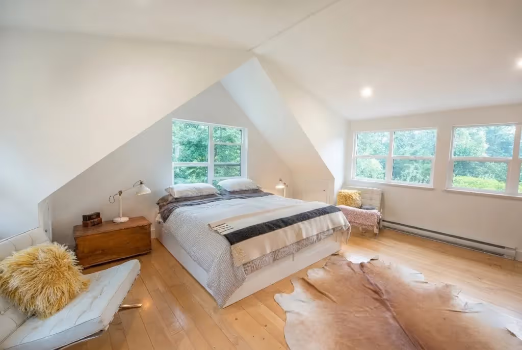 Sun-drenched primary suite in Garden of Eden renovation with seamless outdoor garden connection
