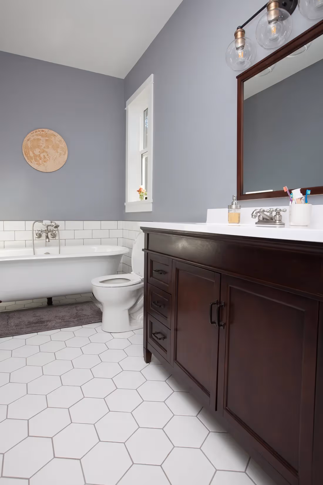 Custom tiled bathroom in Cumberland heritage home rebuild with artisanal craftsmanship and modern finishes