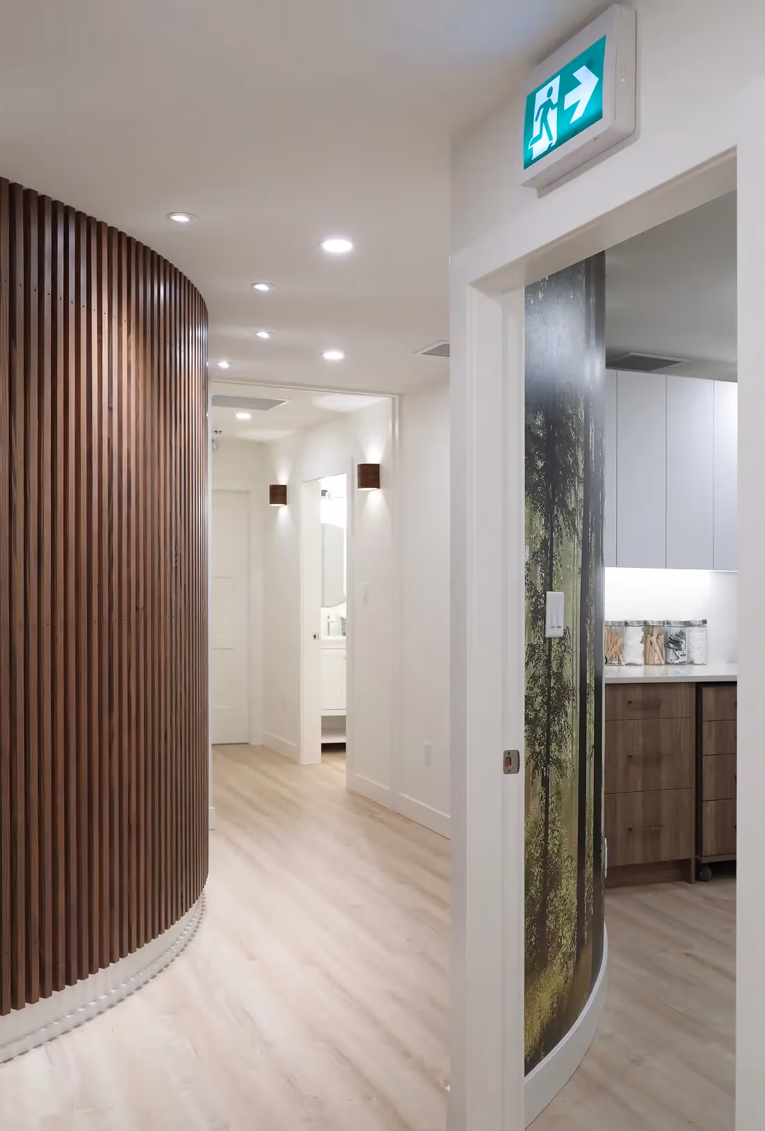 Custom curved wood feature wall in Westward Medical Clinic creating a calming Comox Valley-inspired atmosphere