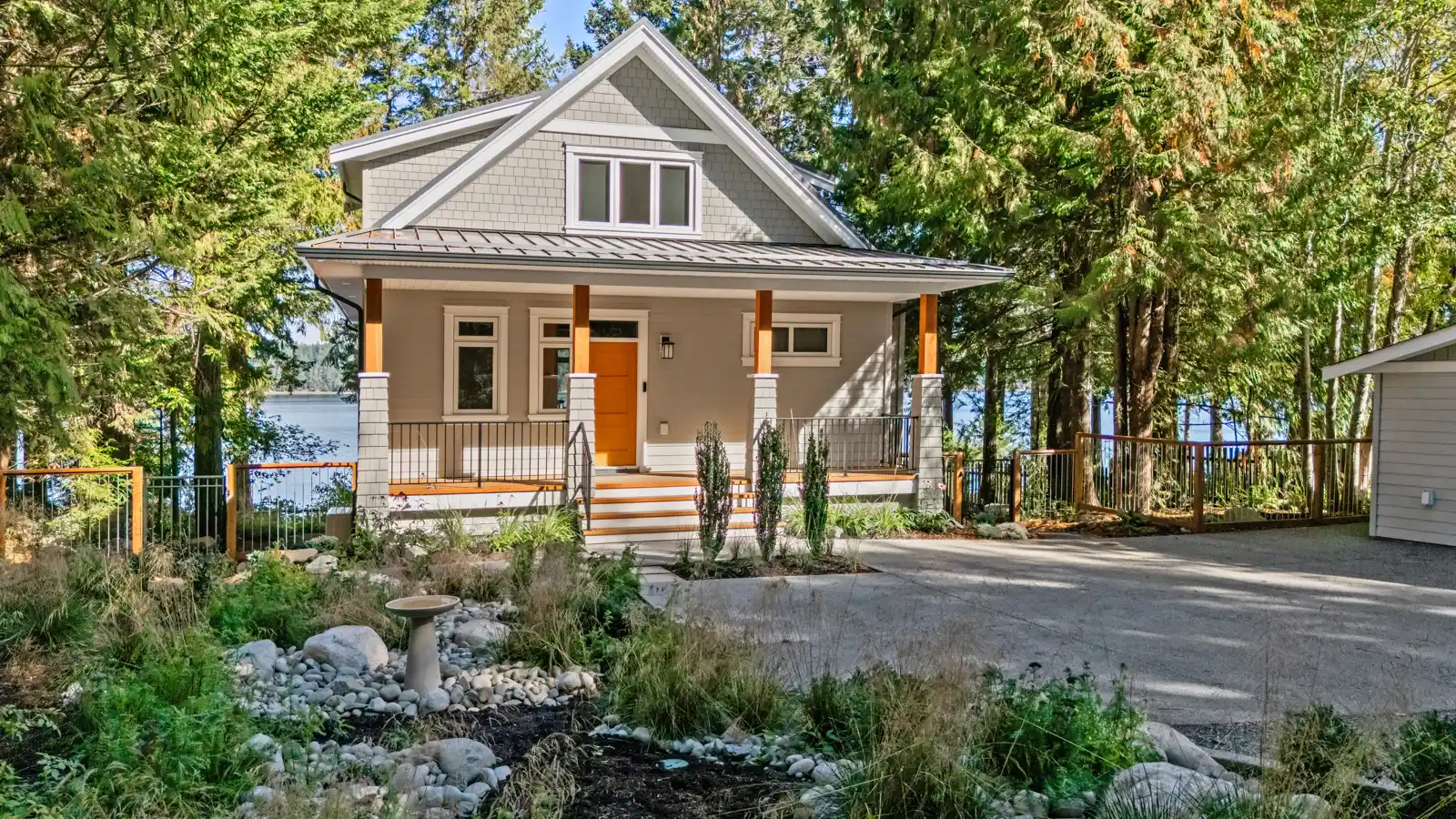 Misty Bluff custom home exterior perched on the bluffs at Ships Point, Vancouver Island, with sloped roofline and west coast craftsman styling