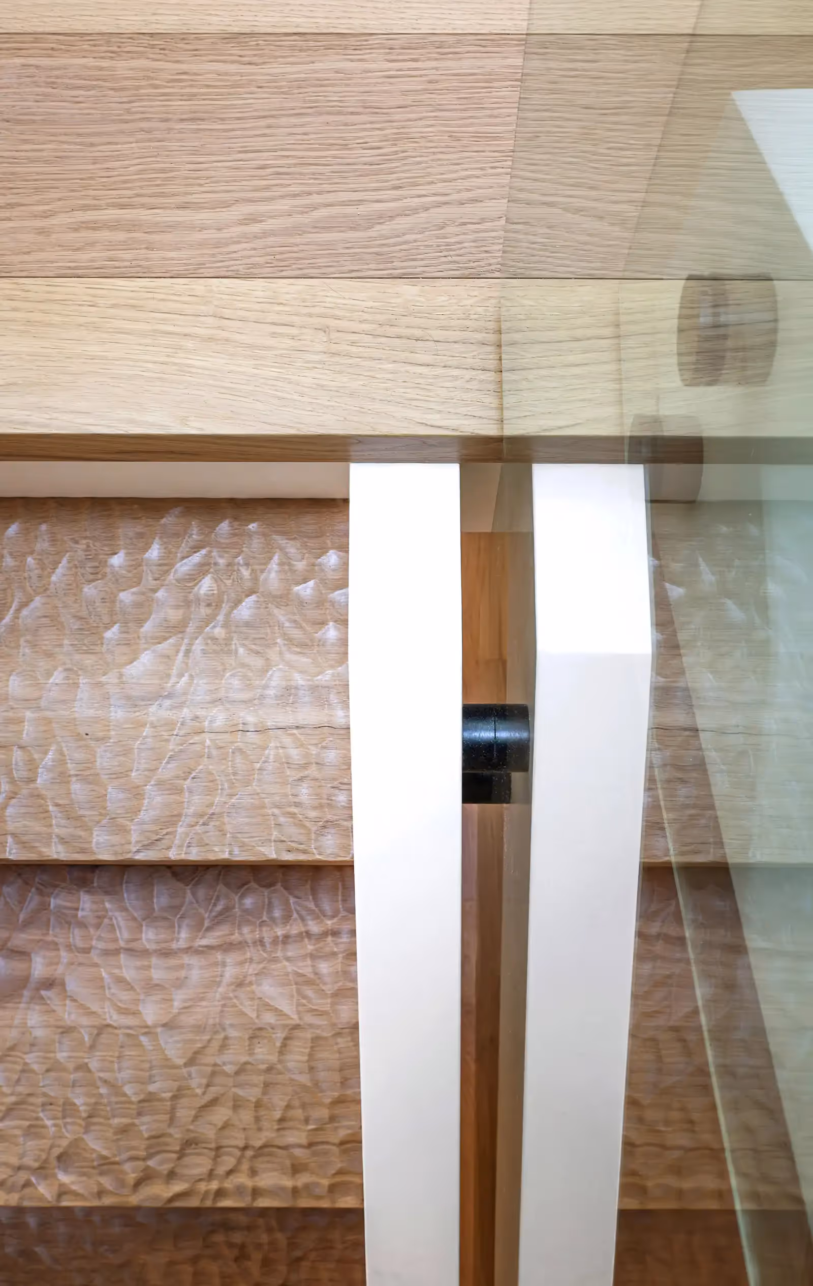 Adze-crafted staircase with custom millwork detail in Pine Forest modern west coast home