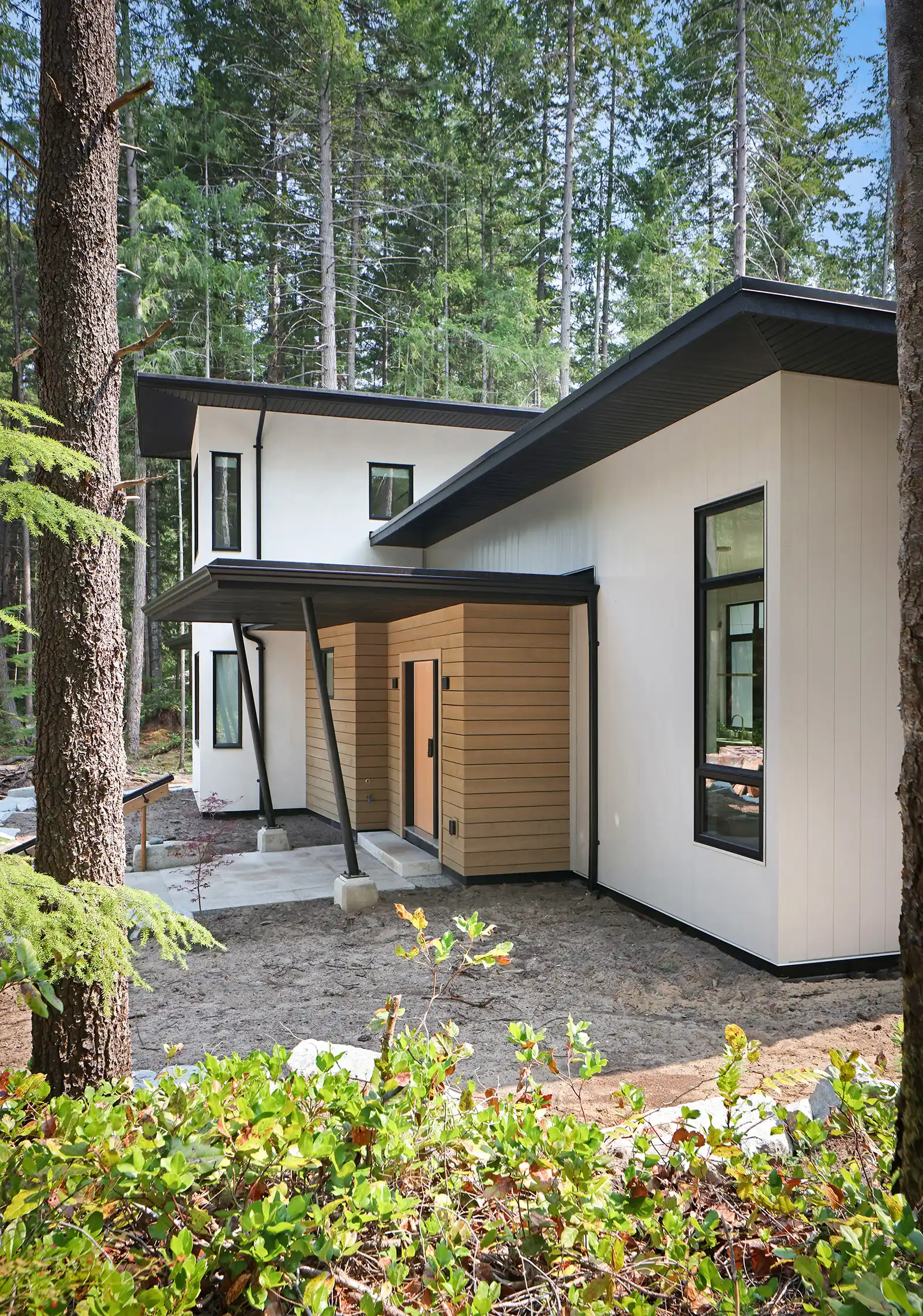 Dining and living area of Pine Forest home with natural light and seamless flow to outdoor spaces