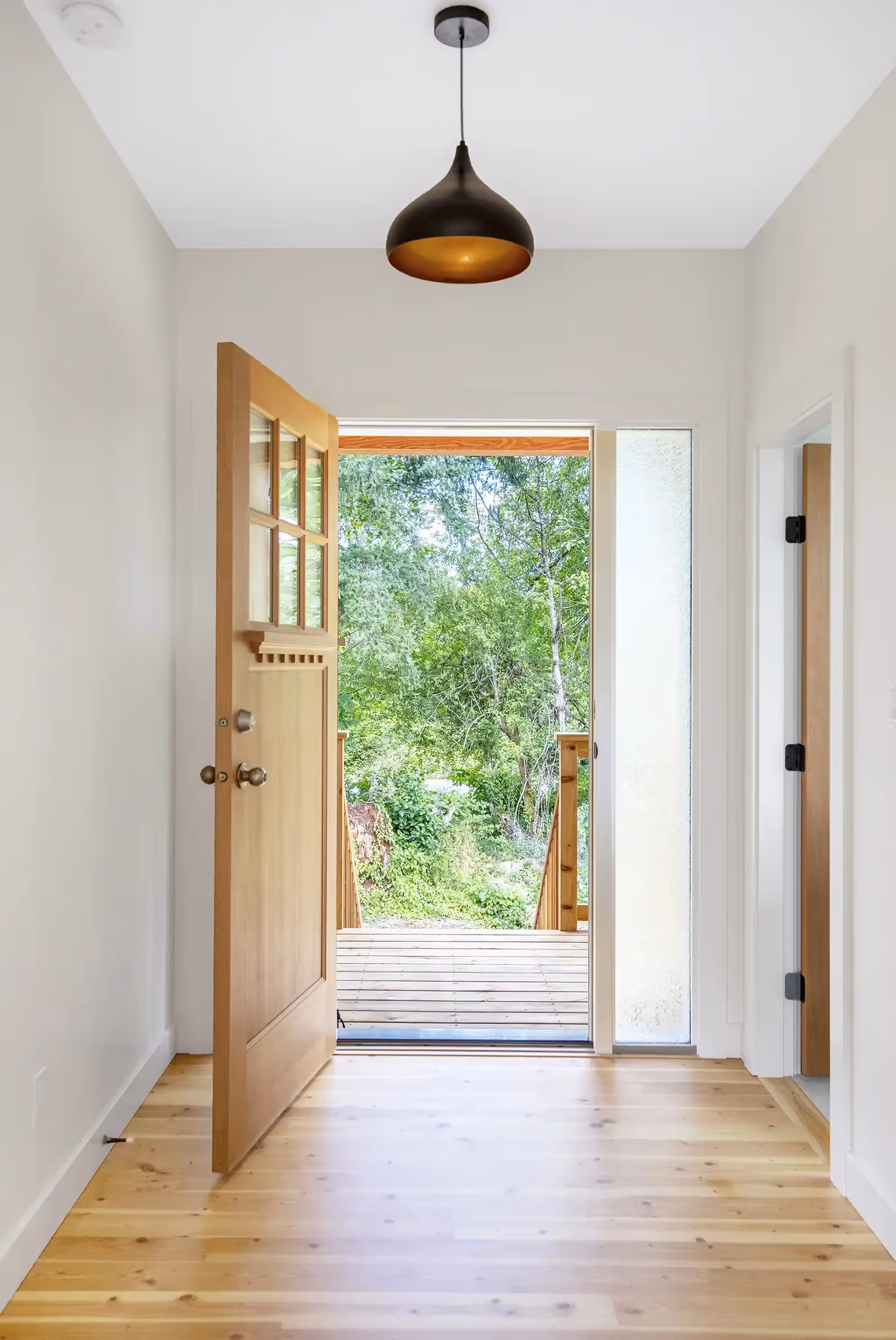 An open door showing the forest on the White Castle Project