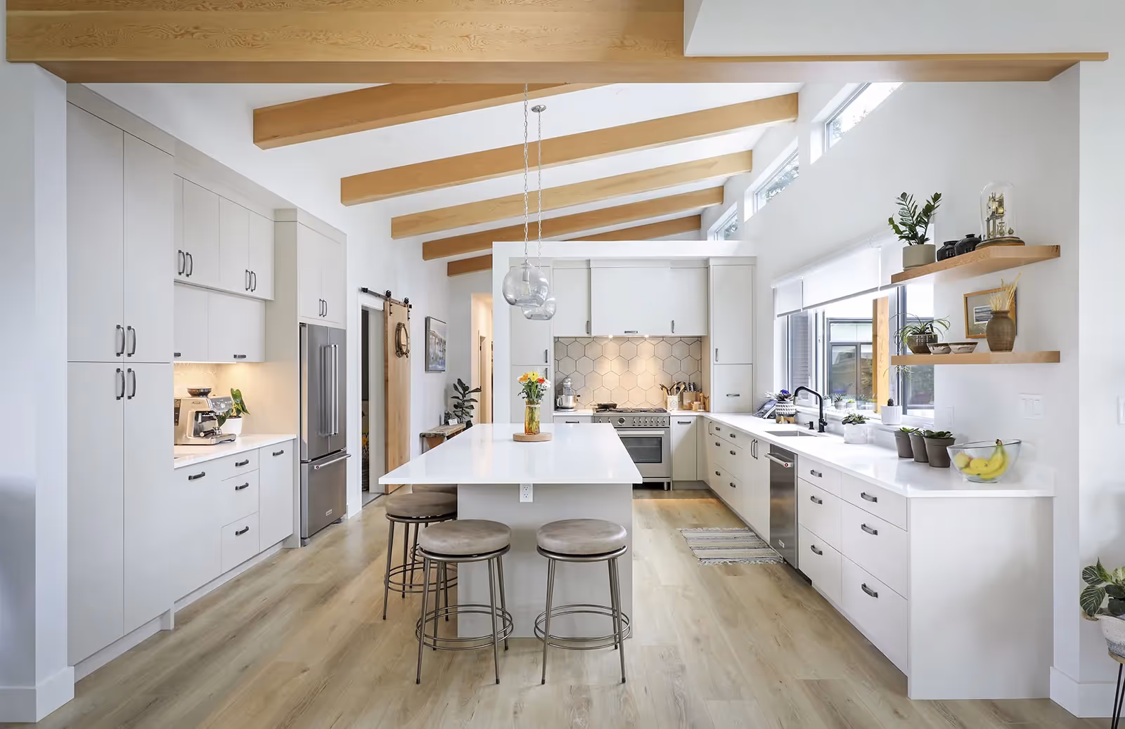 Light-filled open-concept kitchen and dining area in Little River Landing with modern coastal finishes