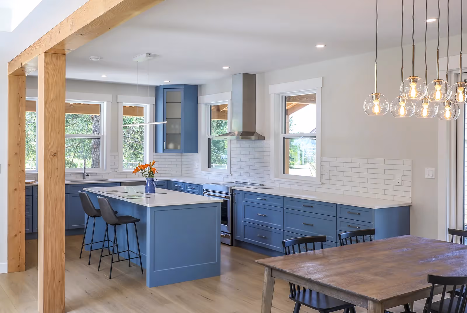 Bright chef's kitchen in Sparrow Station with open layout, modern appliances, and large windows