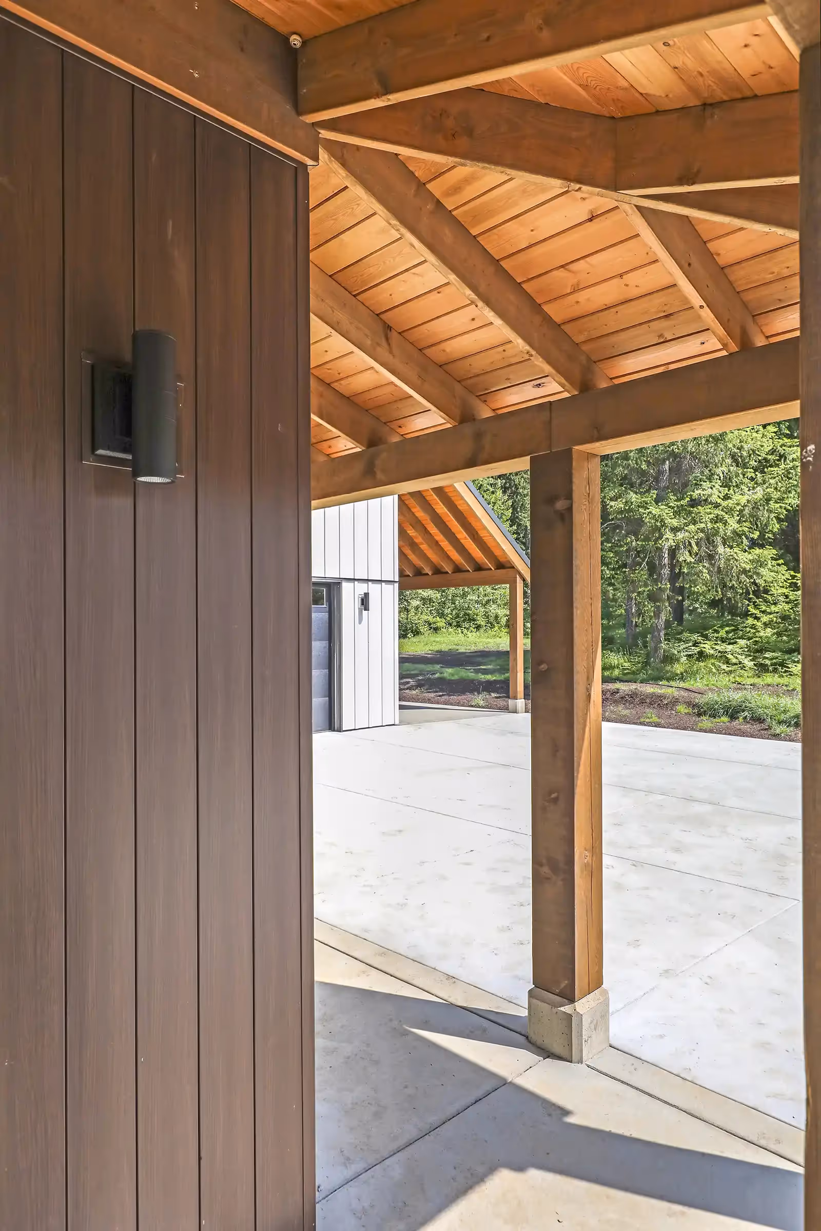 Serene spa-like bathroom in Sparrow Station with contemporary fixtures and sliding glass doors to outdoor space