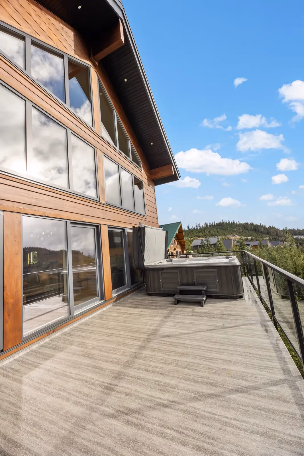 Warm living area of Fjellheim with log wall texture and abundance of natural light