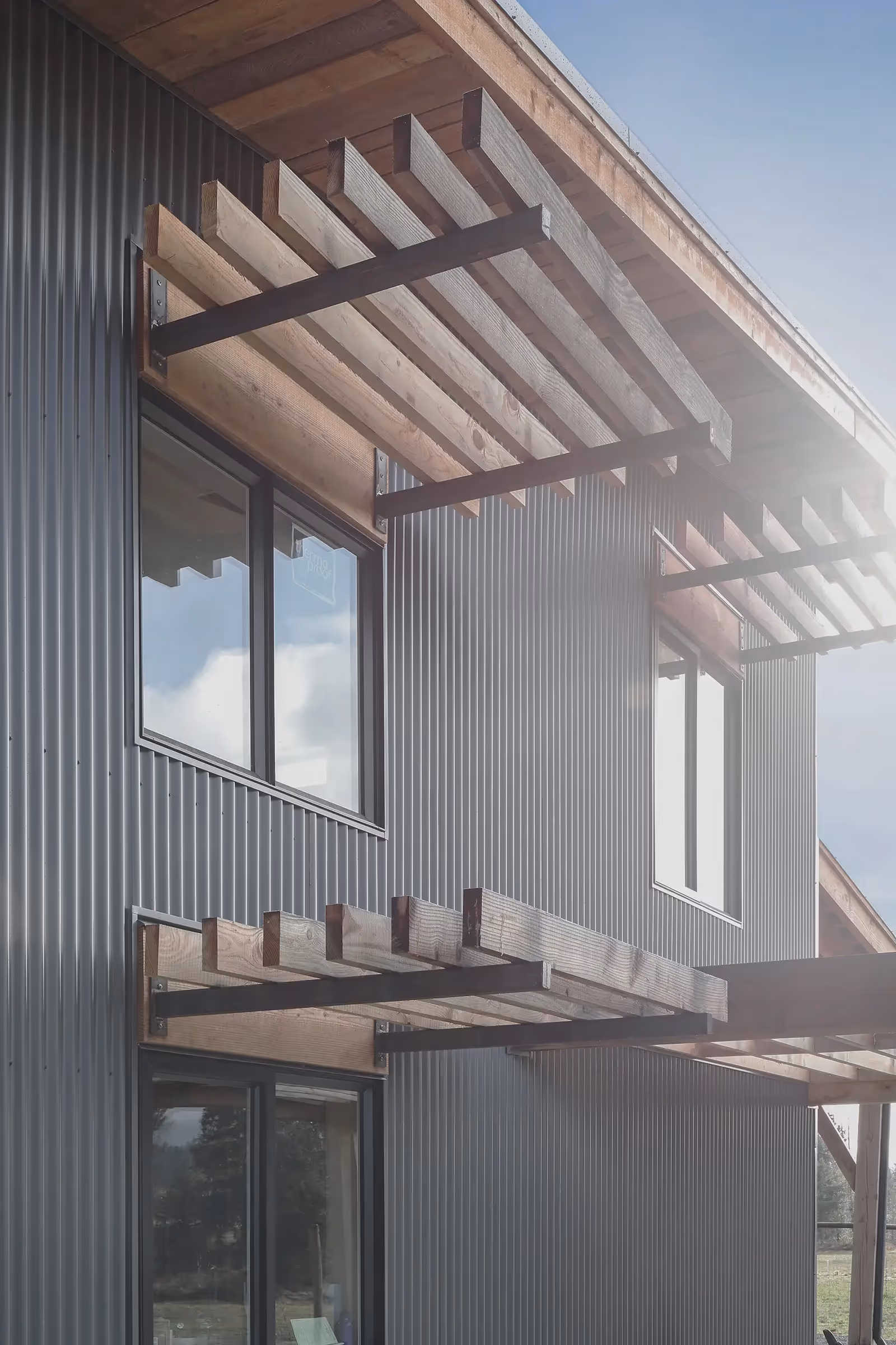 Corten steel exterior detail of Asgard Farm workshop with contemporary agrarian aesthetic