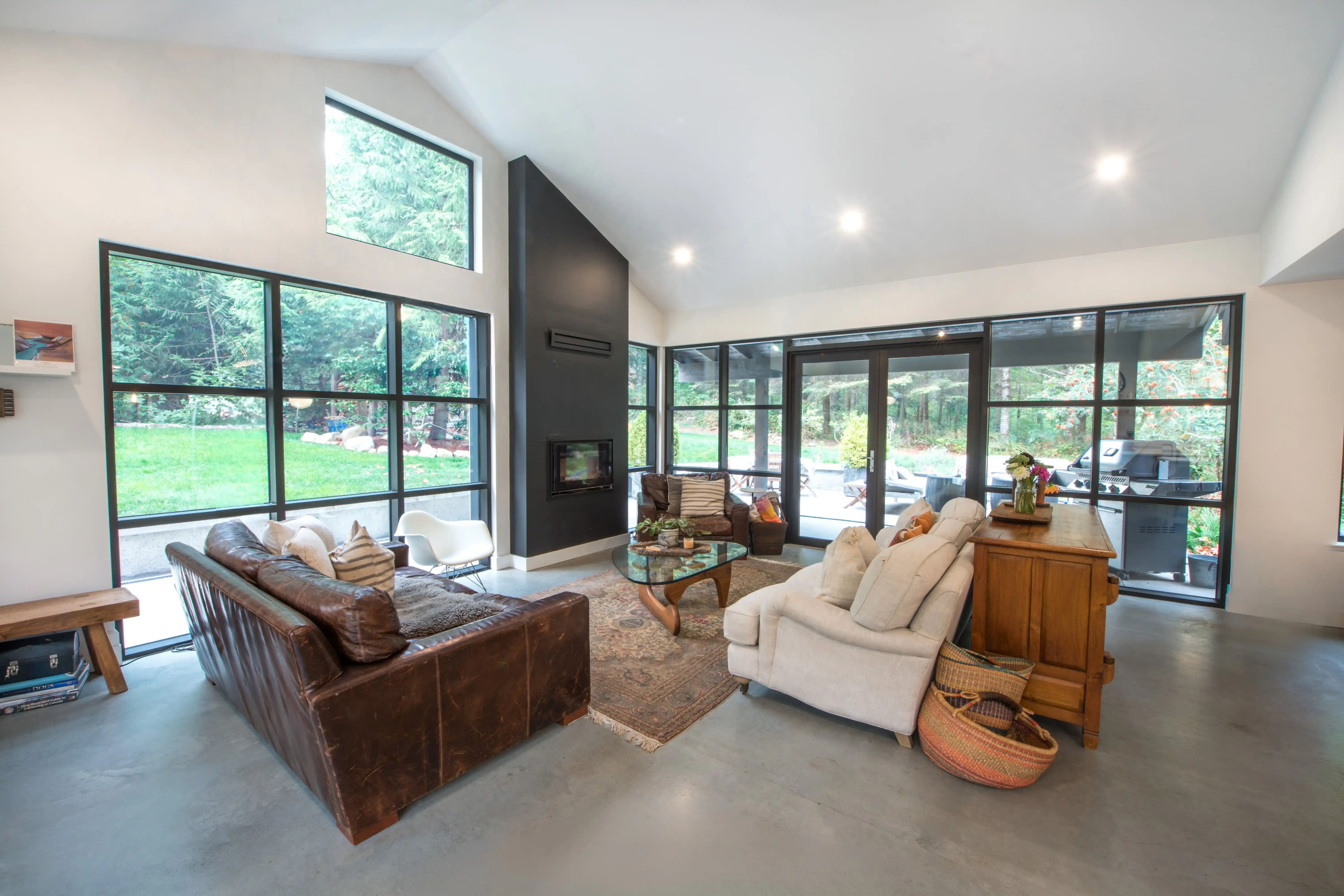 Polished concrete floors and modern floating staircase in Garden of Eden west coast contemporary renovation