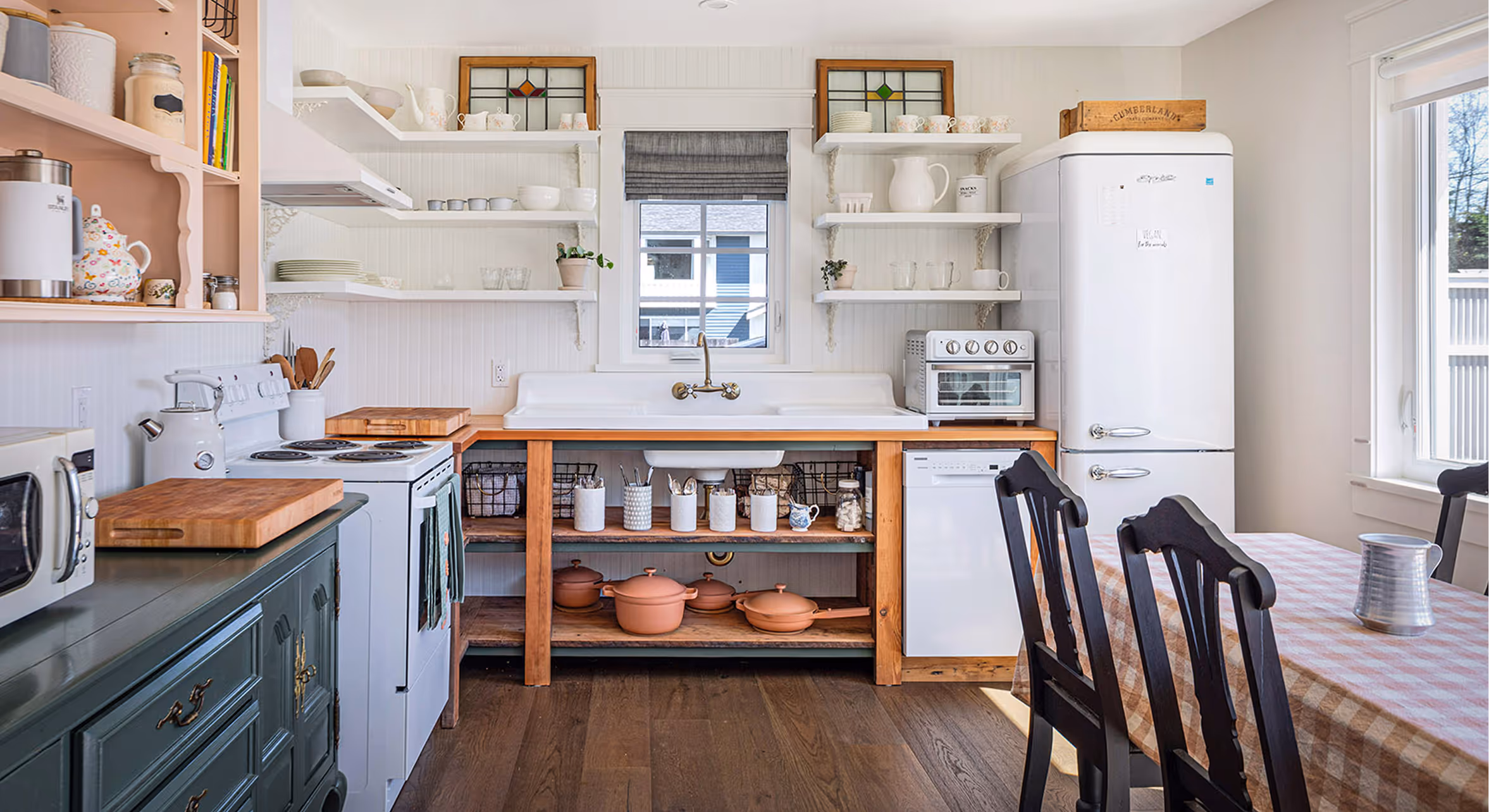 Interior kitchen view of Cumberland Cottage renovation showing warm eclectic styling and reclaimed material details