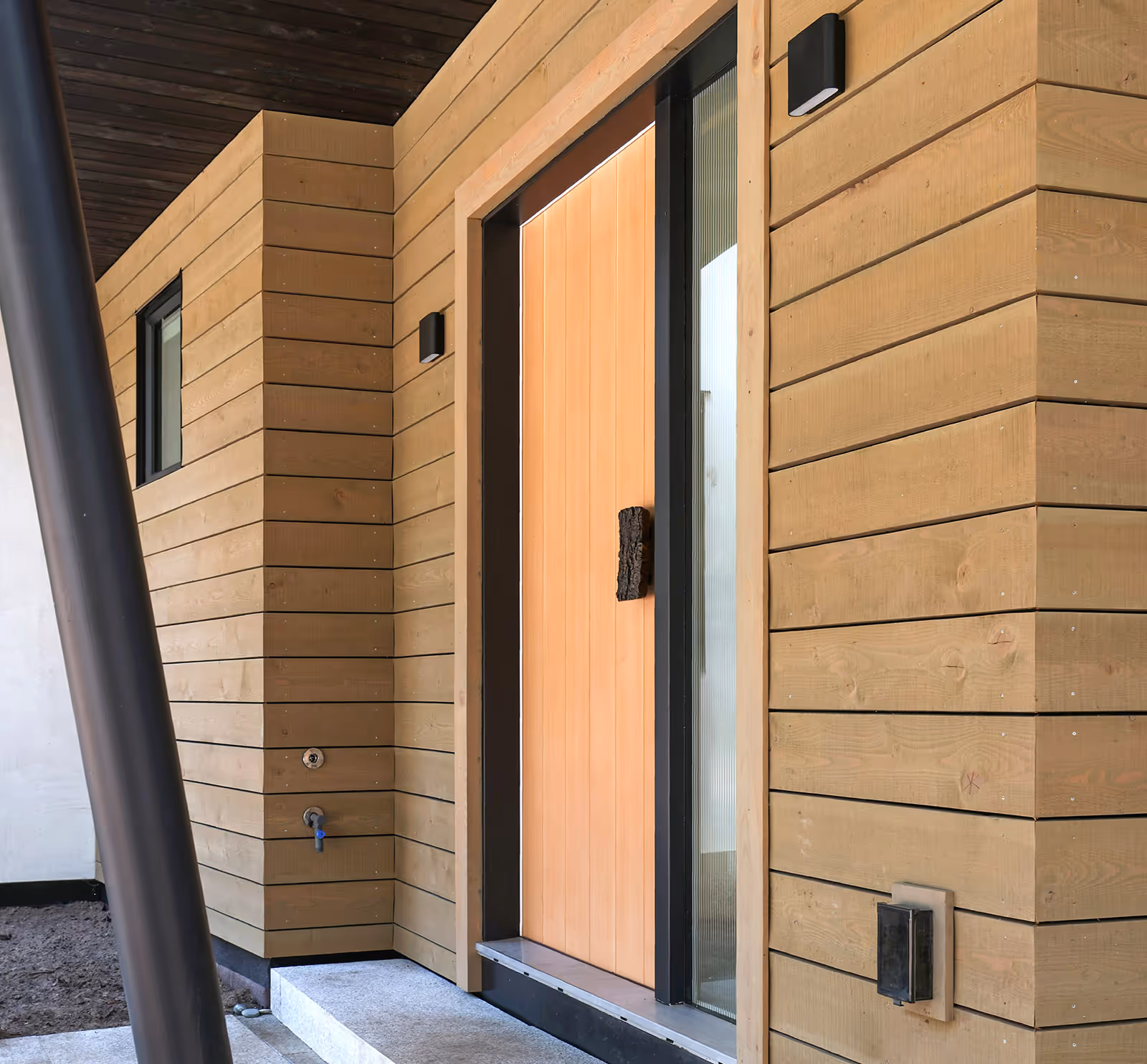 Interior doorway of Pine Forest home showcasing refined modern craftsmanship and natural light