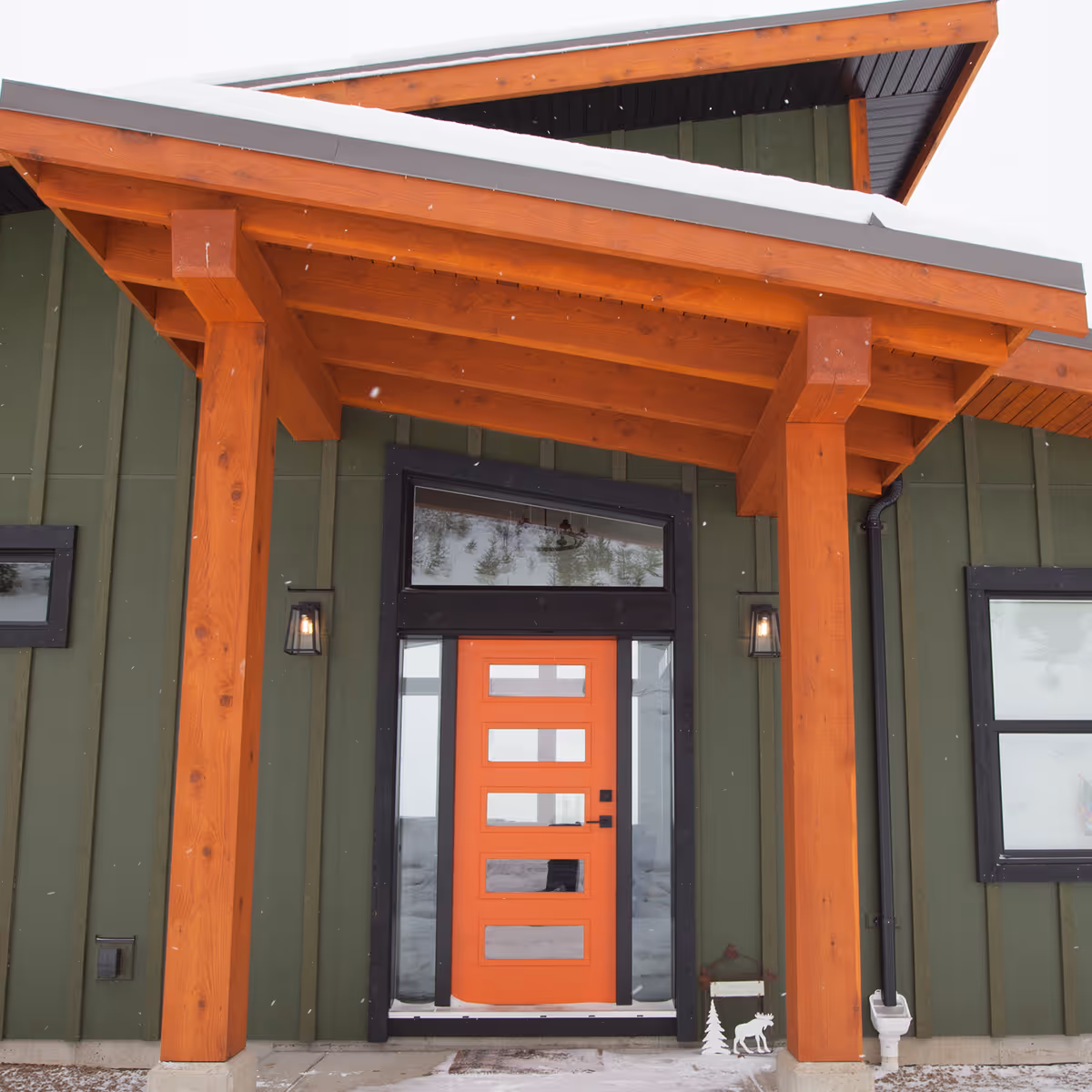 Second doorway detail in The Edge home with natural wood frame and green exterior visible beyond