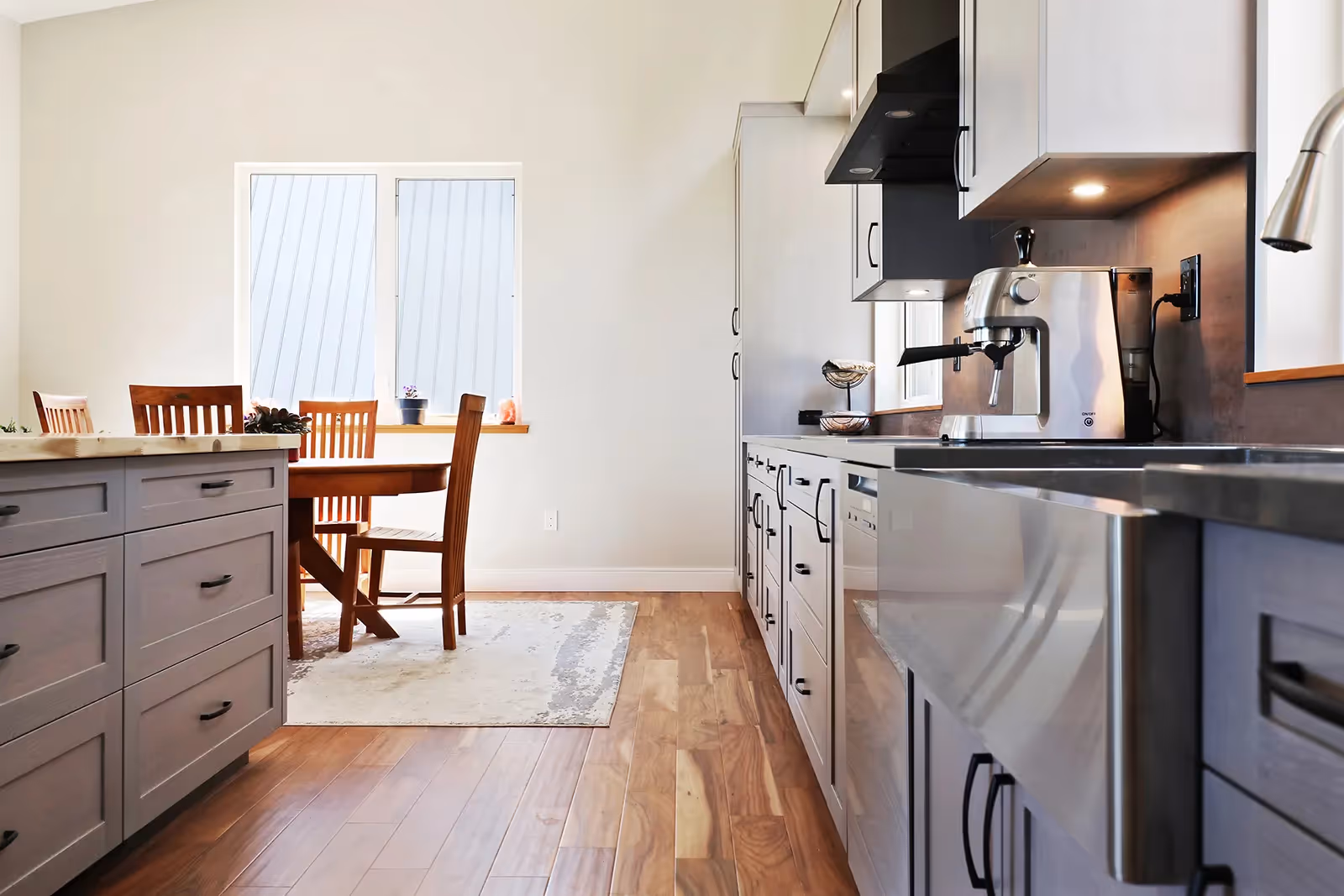 High-end stainless appliances and open-concept kitchen island in Mountain Mist Forbidden Plateau home