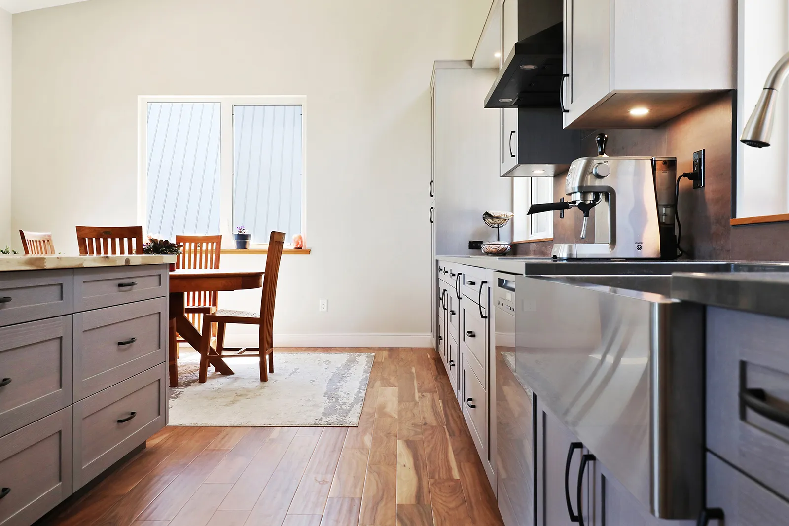 High-end stainless appliances and open-concept kitchen island in Mountain Mist Forbidden Plateau home