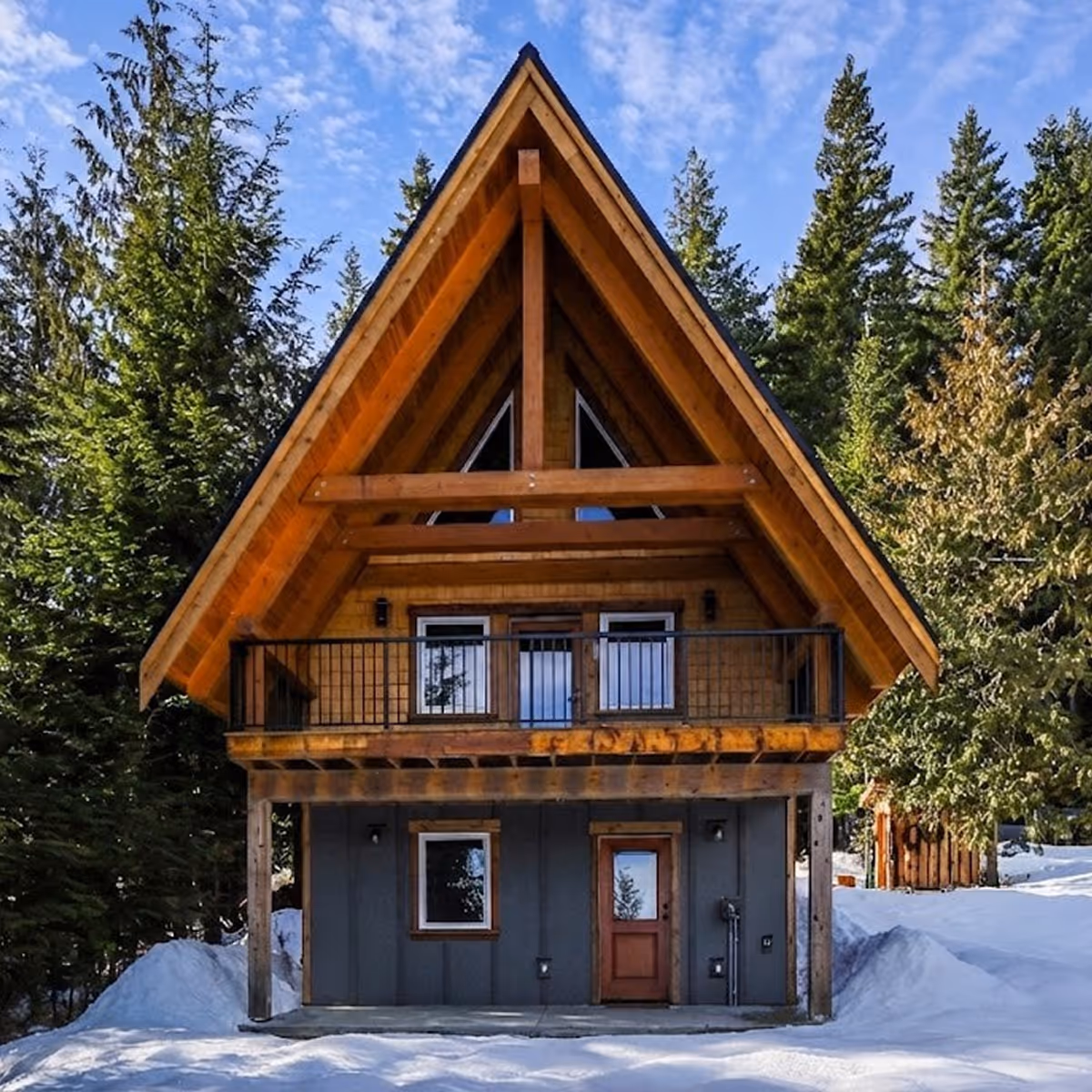 Exterior front view of the A Plus A-frame cabin in Forbidden Plateau with cedar shake siding and black metal roof