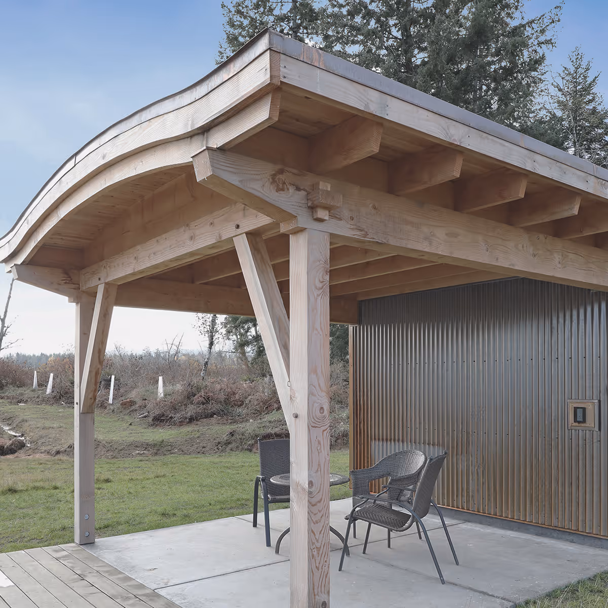 Full exterior view of Asgard Farm workshop and pump house with barrel-shaped green roof in Black Creek BC