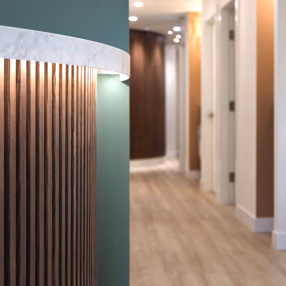 Close-up of curved wooden reception desk in Westward Medical Clinic, Courtenay BC