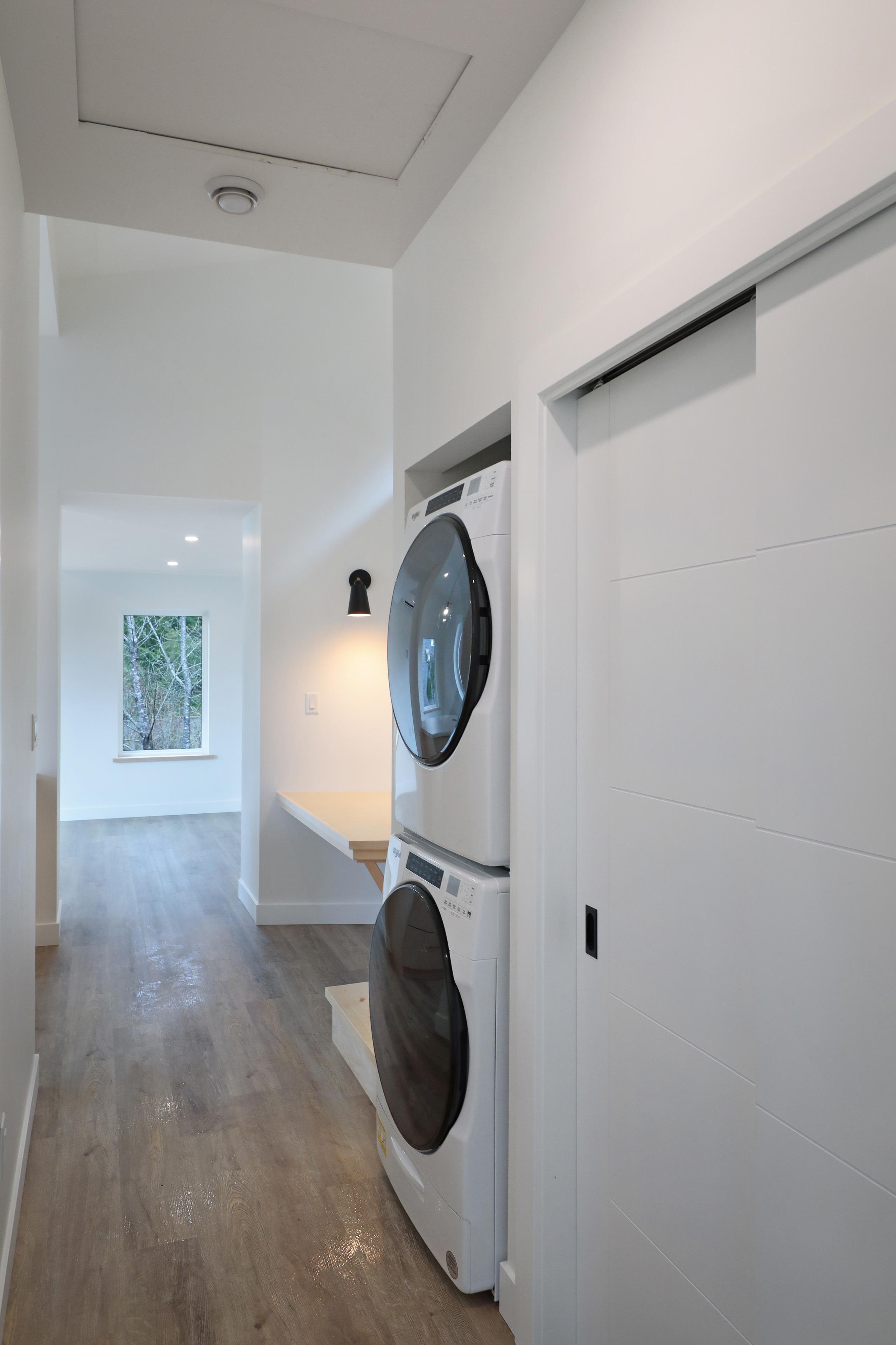 Hidden laundry at the Perch with view of living area