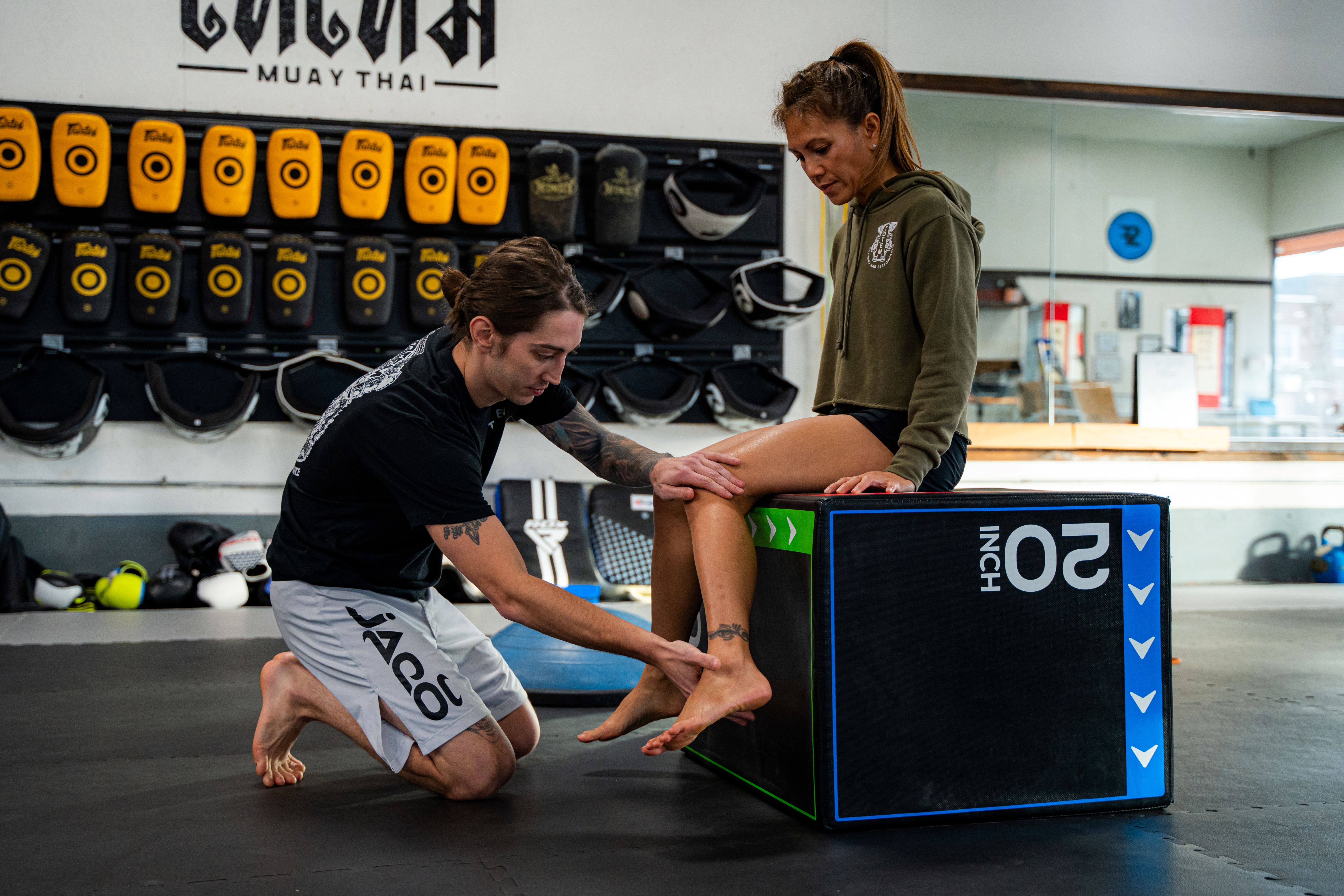A physical therapist assessing hip mobility