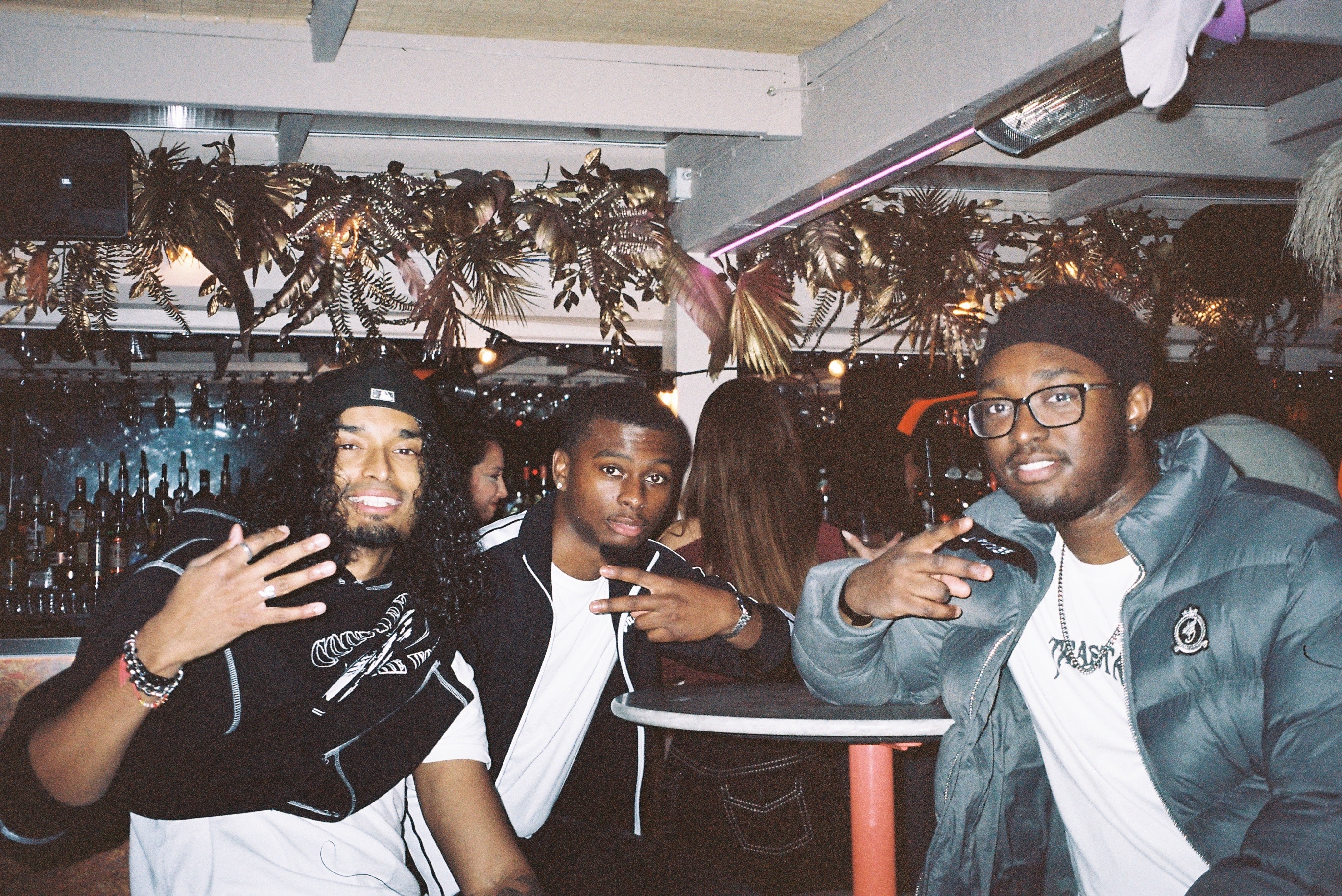 image of people enjoying drinks at the bar