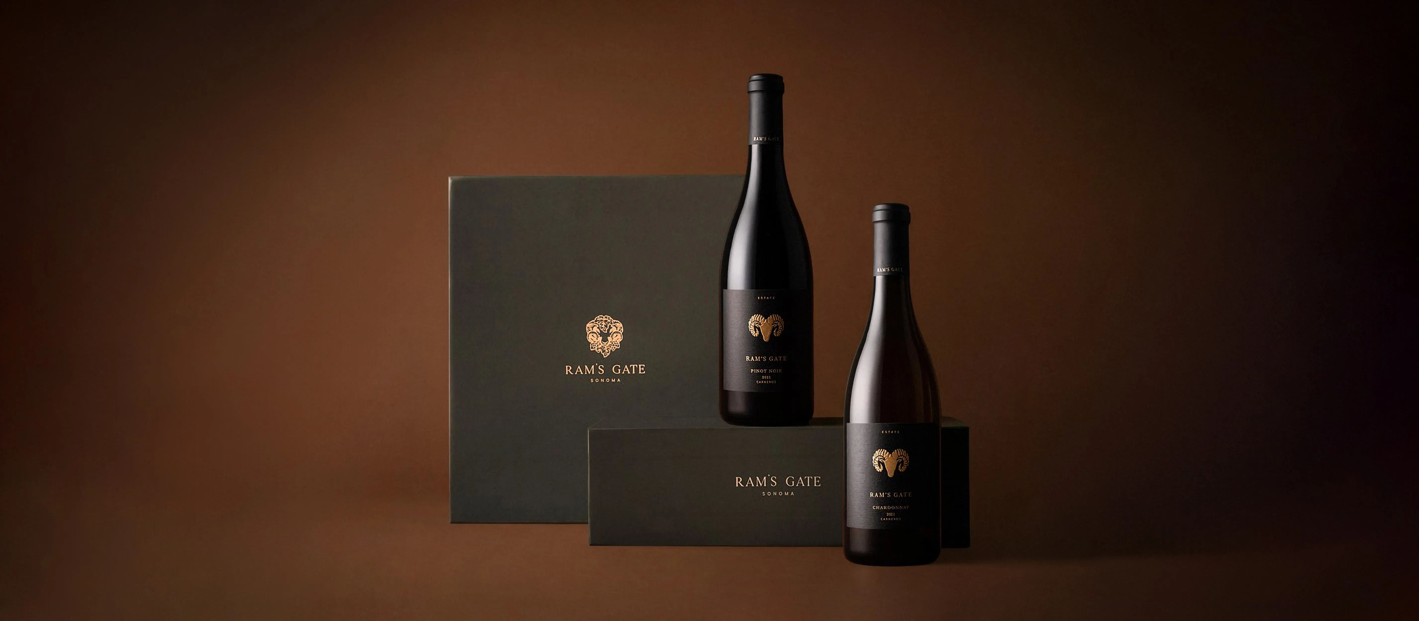 A moody cinematic shot of two premium Ram's Gate wine boxes with their Pinot Noir and Chardonnay.