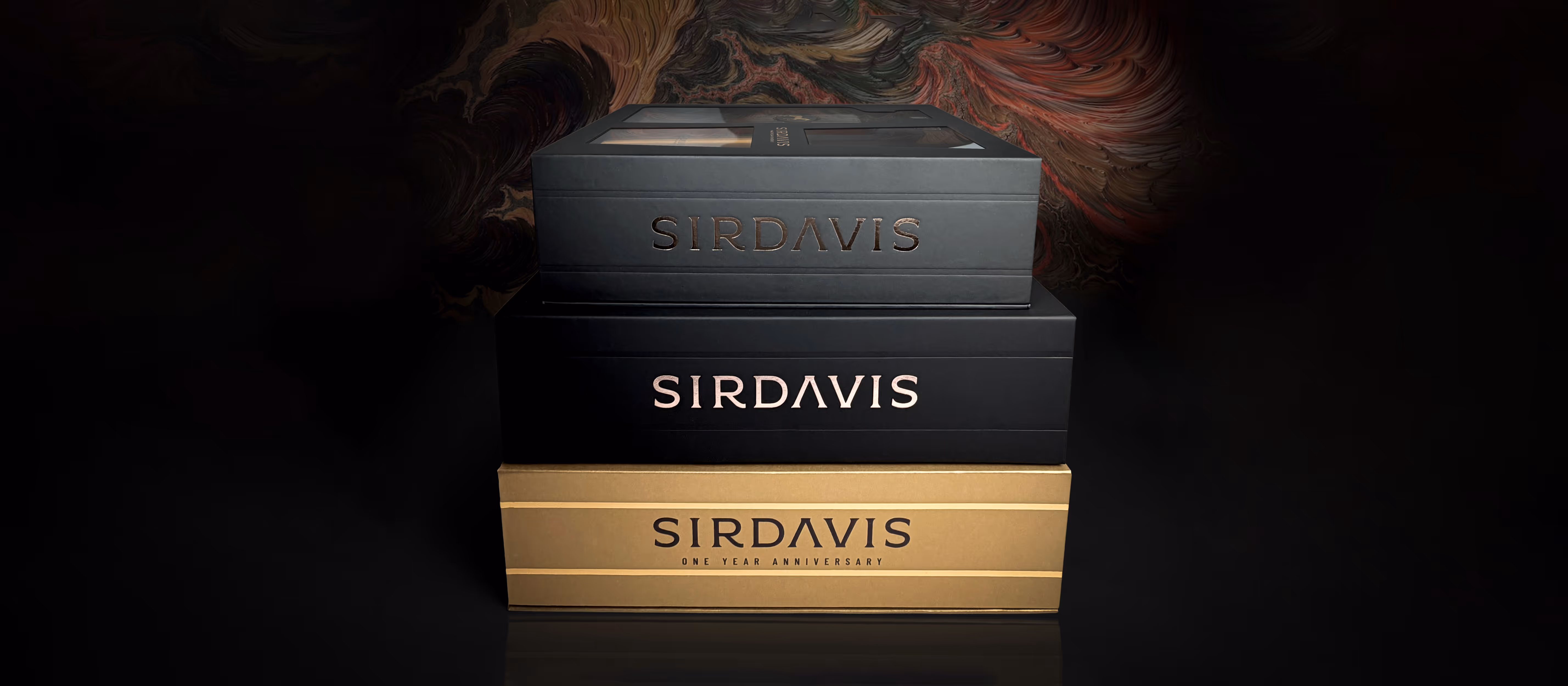 A stack of 3 premium SirDavis whisky boxes lying on top of each other in a moody atmosphere.