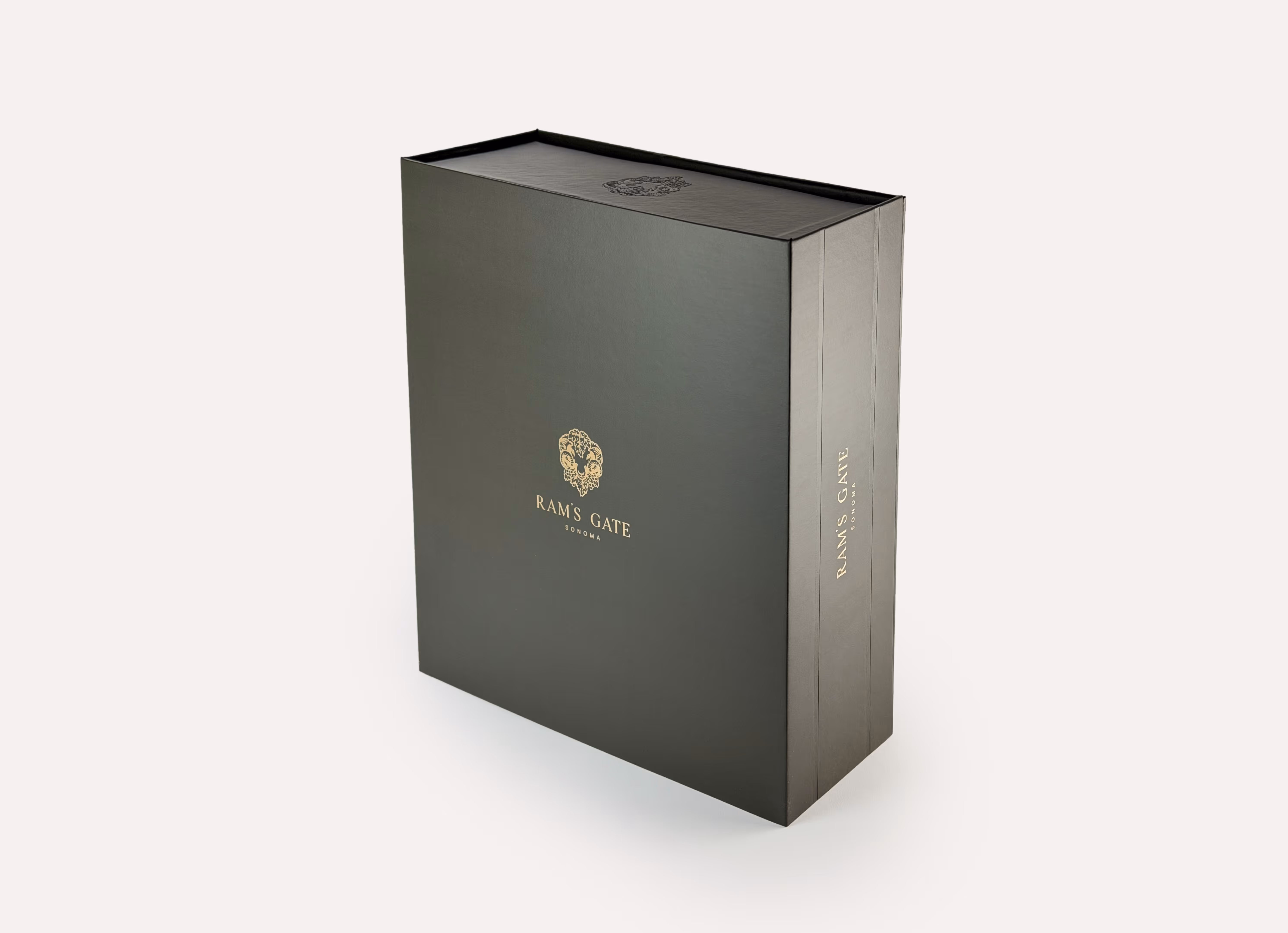 A premium closed 3-bottle Ram's Gate wine box with detailed rose gold foil logos on the front and side.