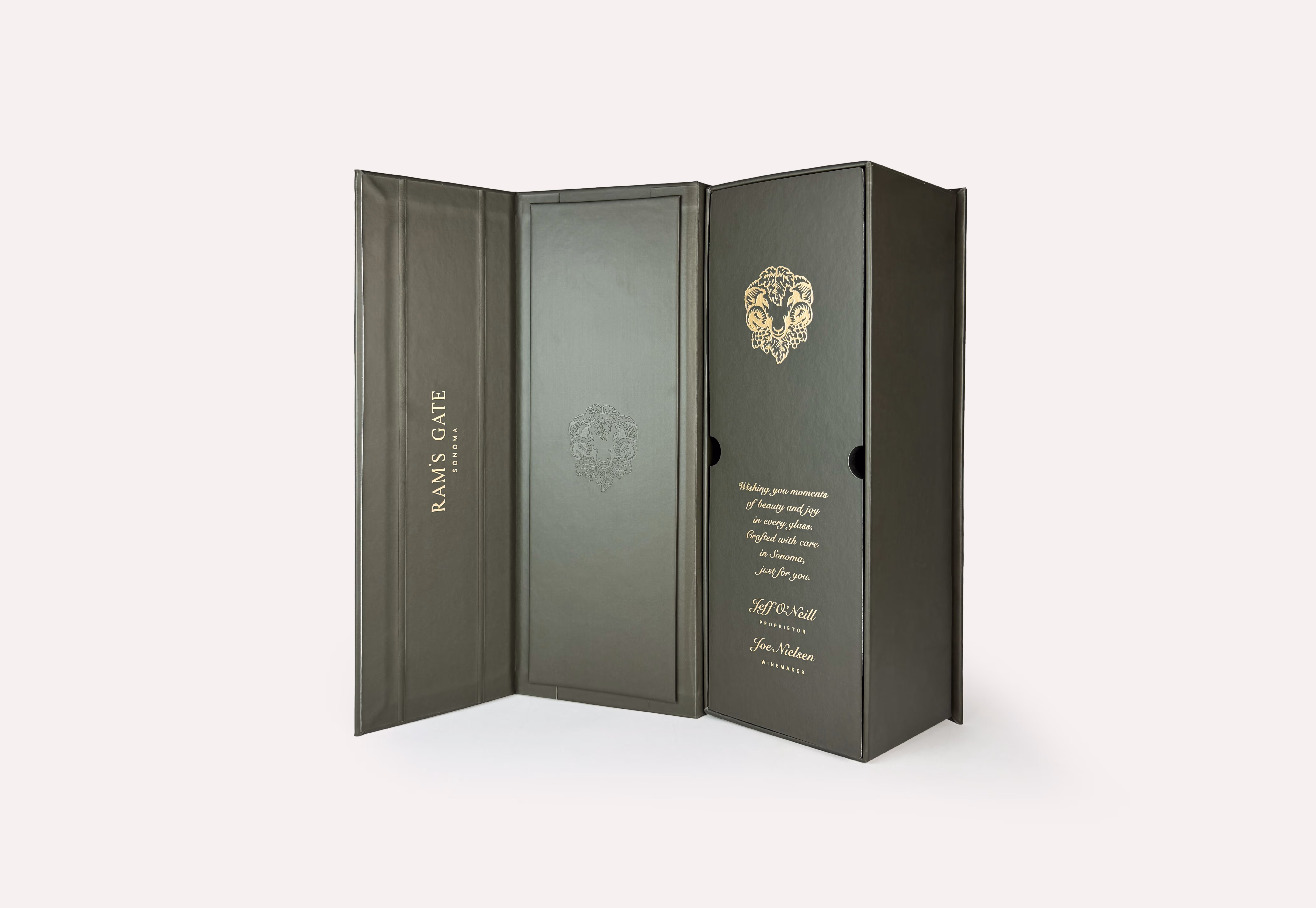 An open premium dark green Ram's Gate 1-bottle box with highly detailed gold foil and blind debossed logos.