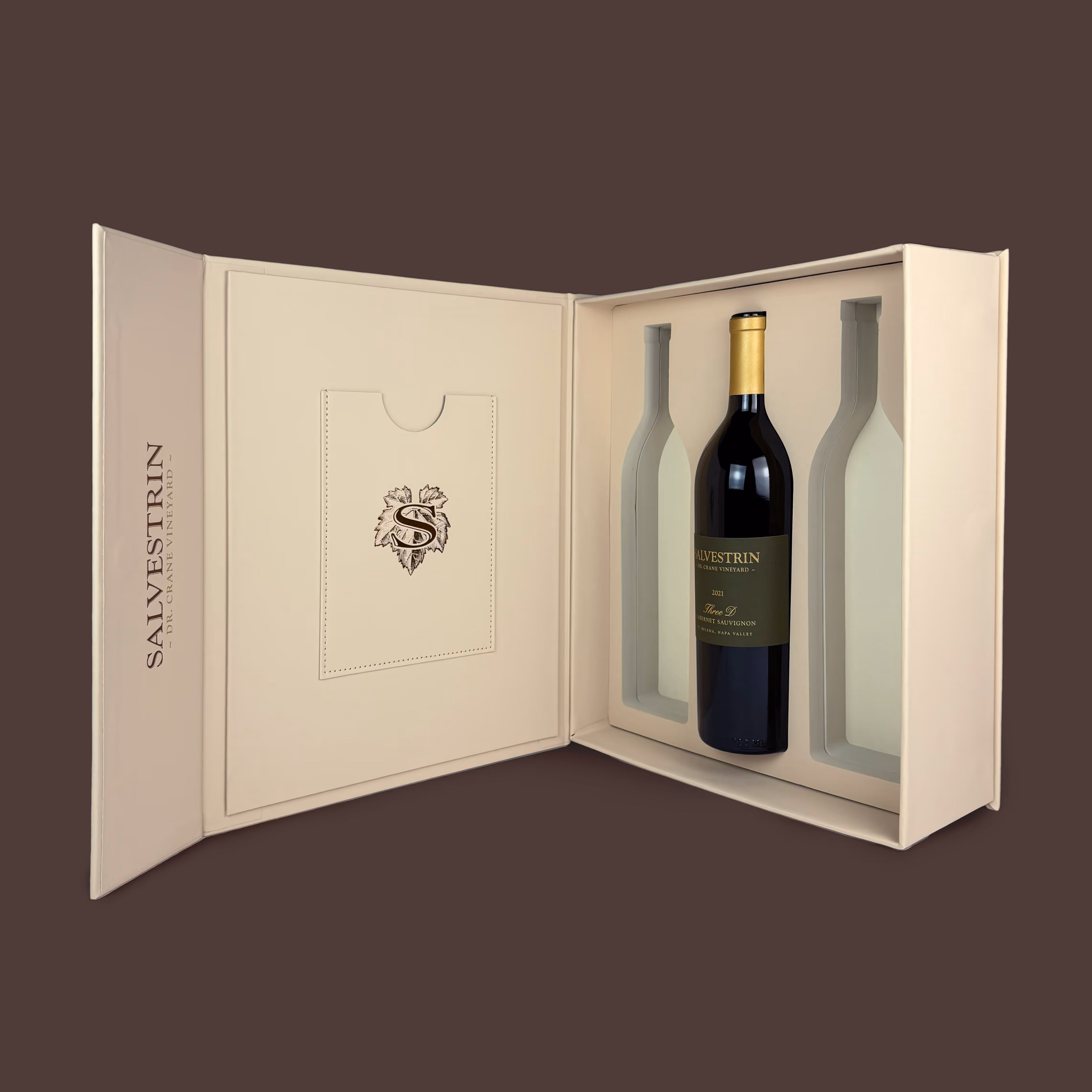 An open premium beige color Salvestrin 3-bottle wine box with high-end brown foil logos on the front and side.