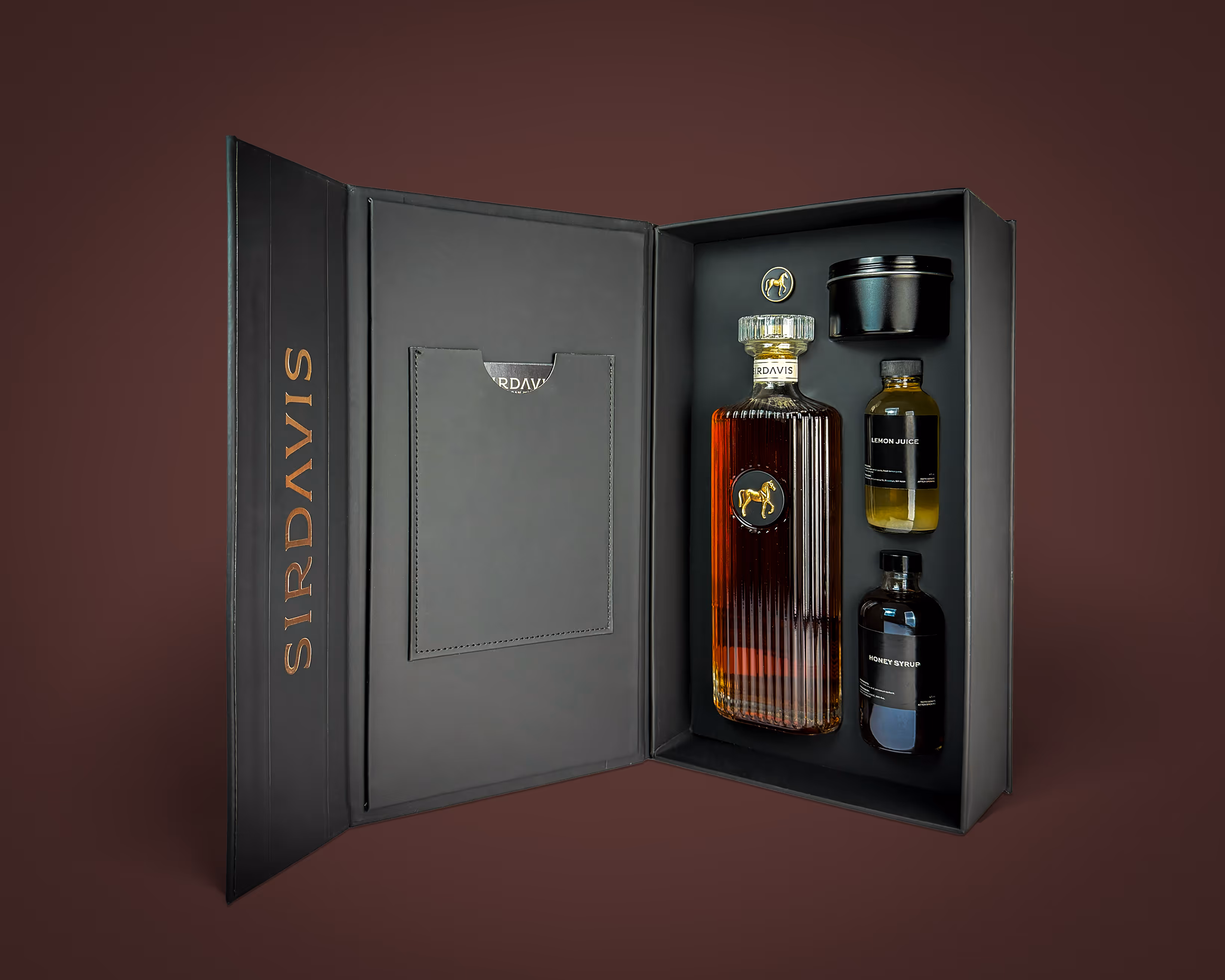 An open SirDavis cocktail kit with all the items from the series like the Sirdavis signature bottle to the honey syrups.
