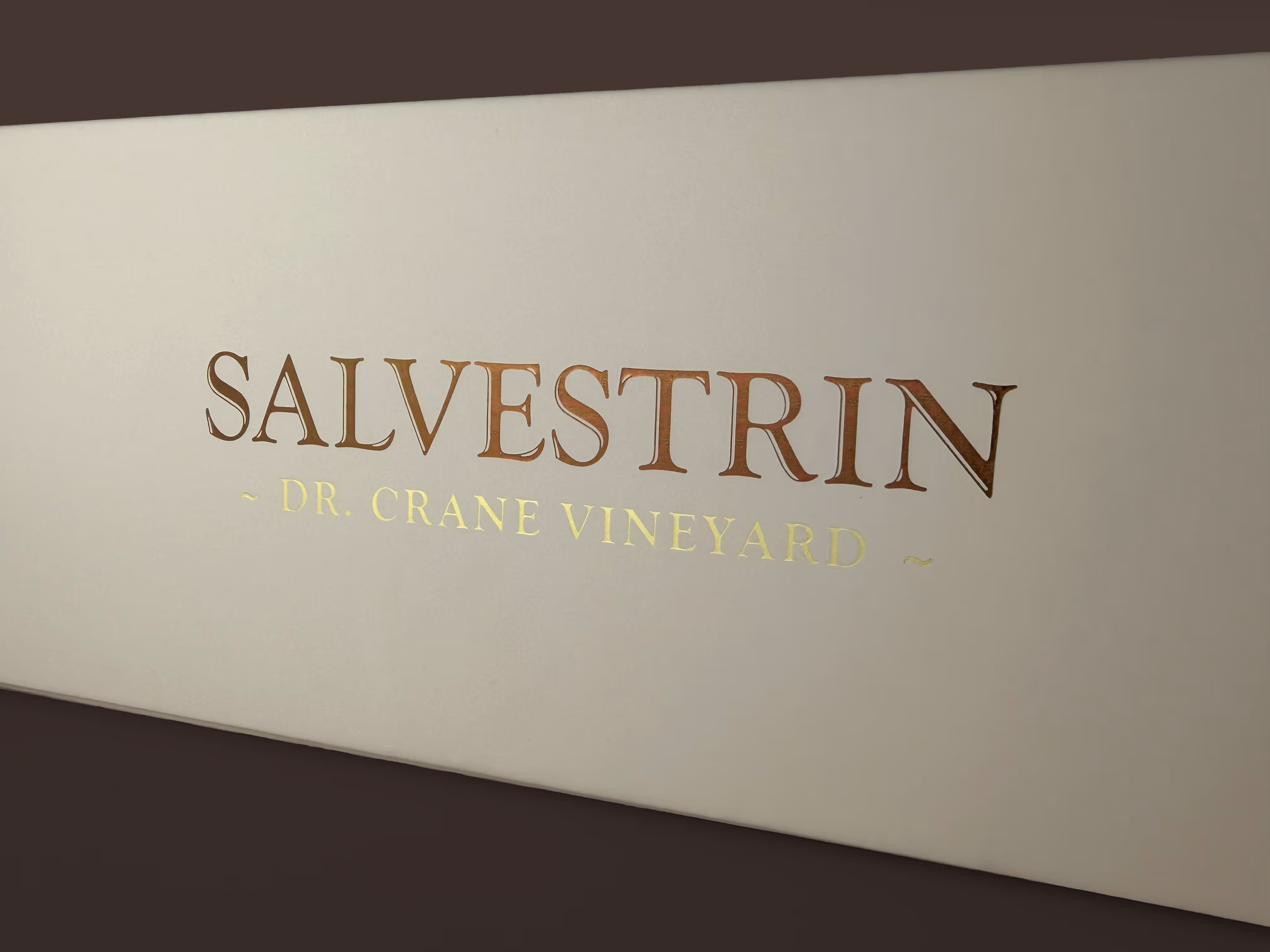 Closeup of the Salvestrin logotype on the side of a 3-bottle wine box.