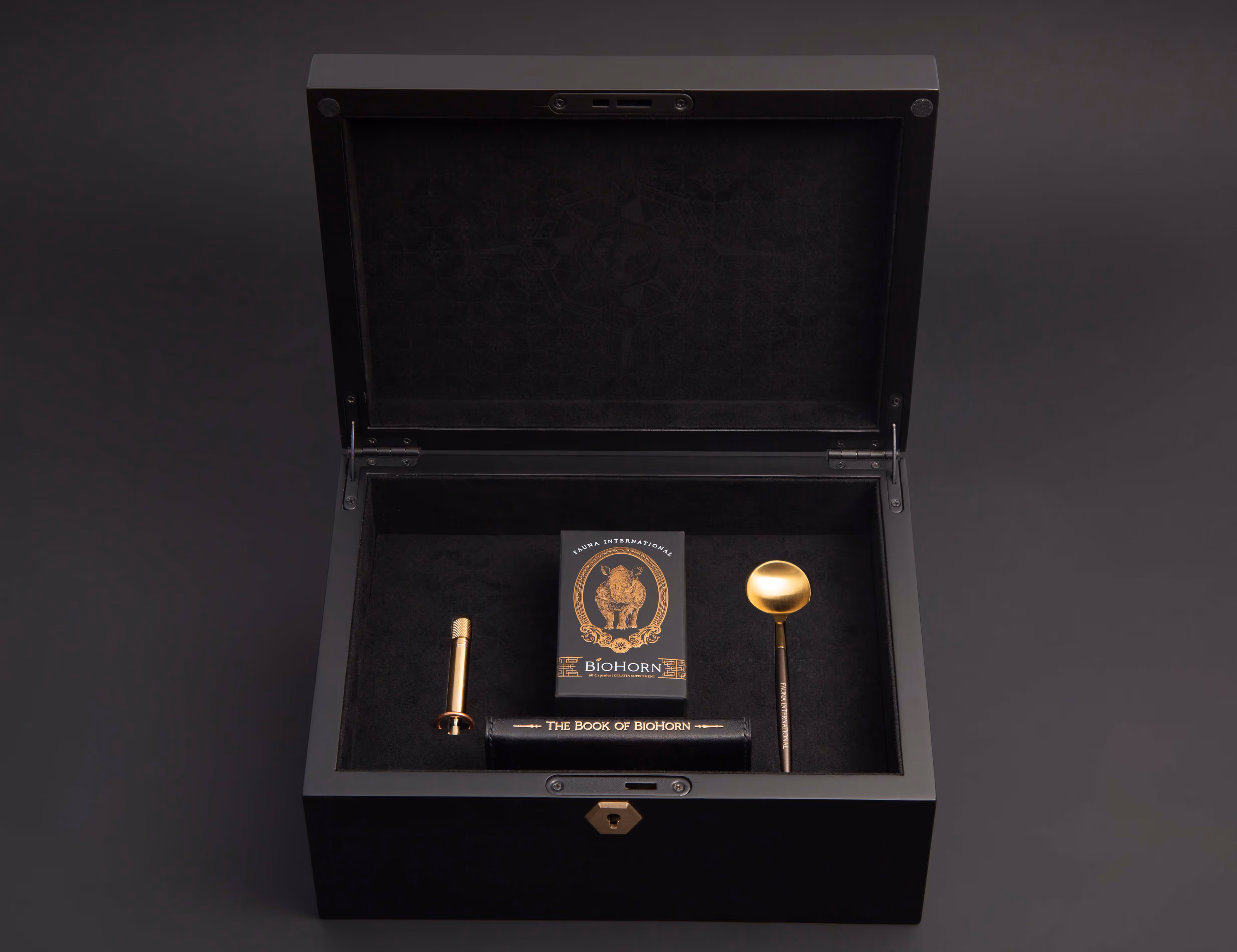 The open wooden BioHorn display box with the intricate hardwares and detailed lasered artwork.