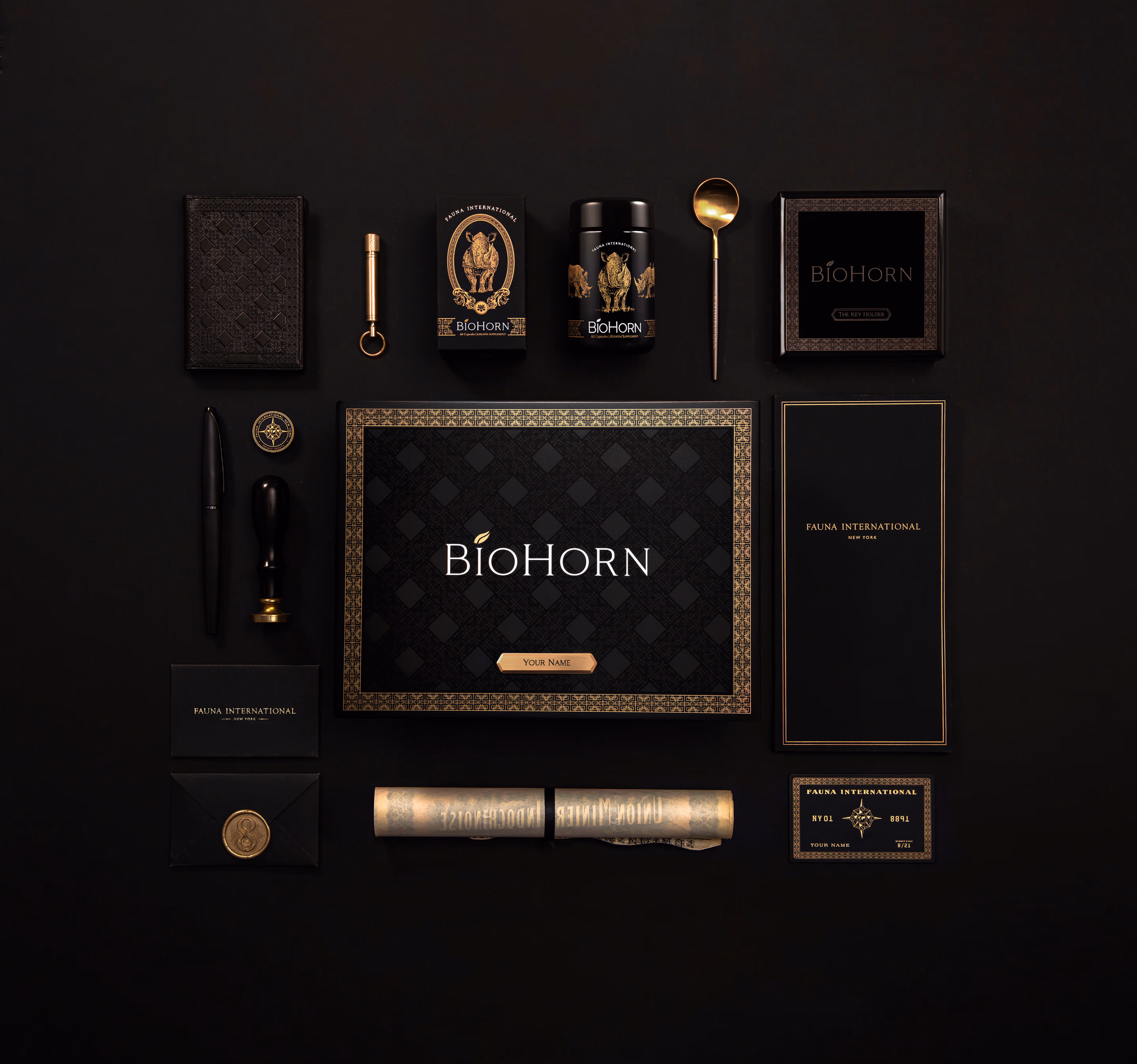 A full display of all the items from the BioHorn Collection including items like the display box, the glass bottle, and personal letter. 