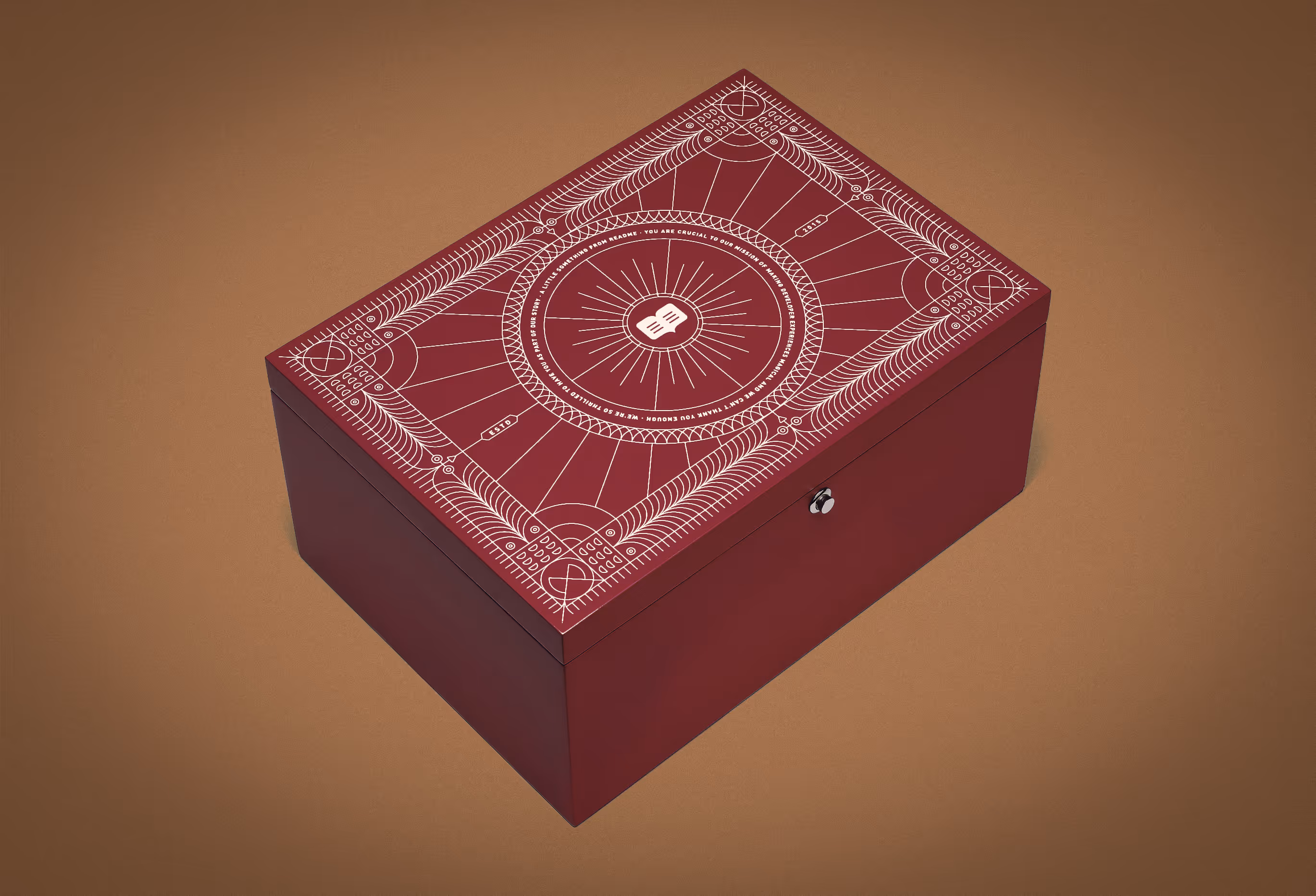 A crimson red Readme new hire box with highly detailed vector artwork on the top. 