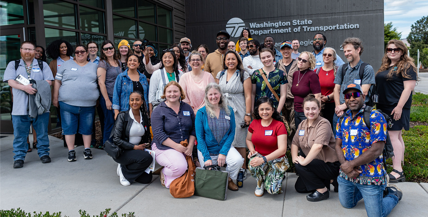 A group photo of Parfait Bassalé and workshop attendees outside of the Washington State Department of Transportation