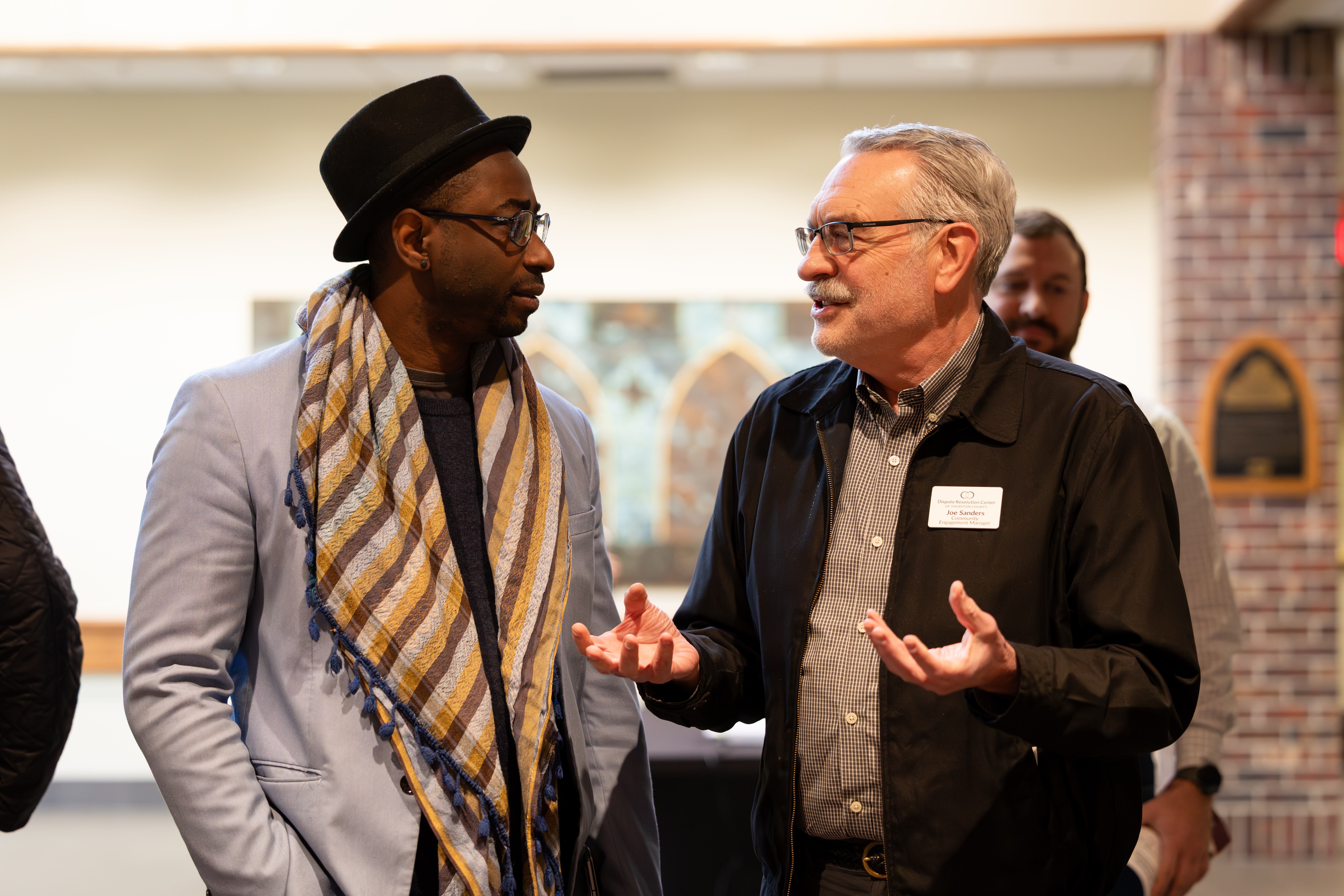 Parfait having a discussion with a man