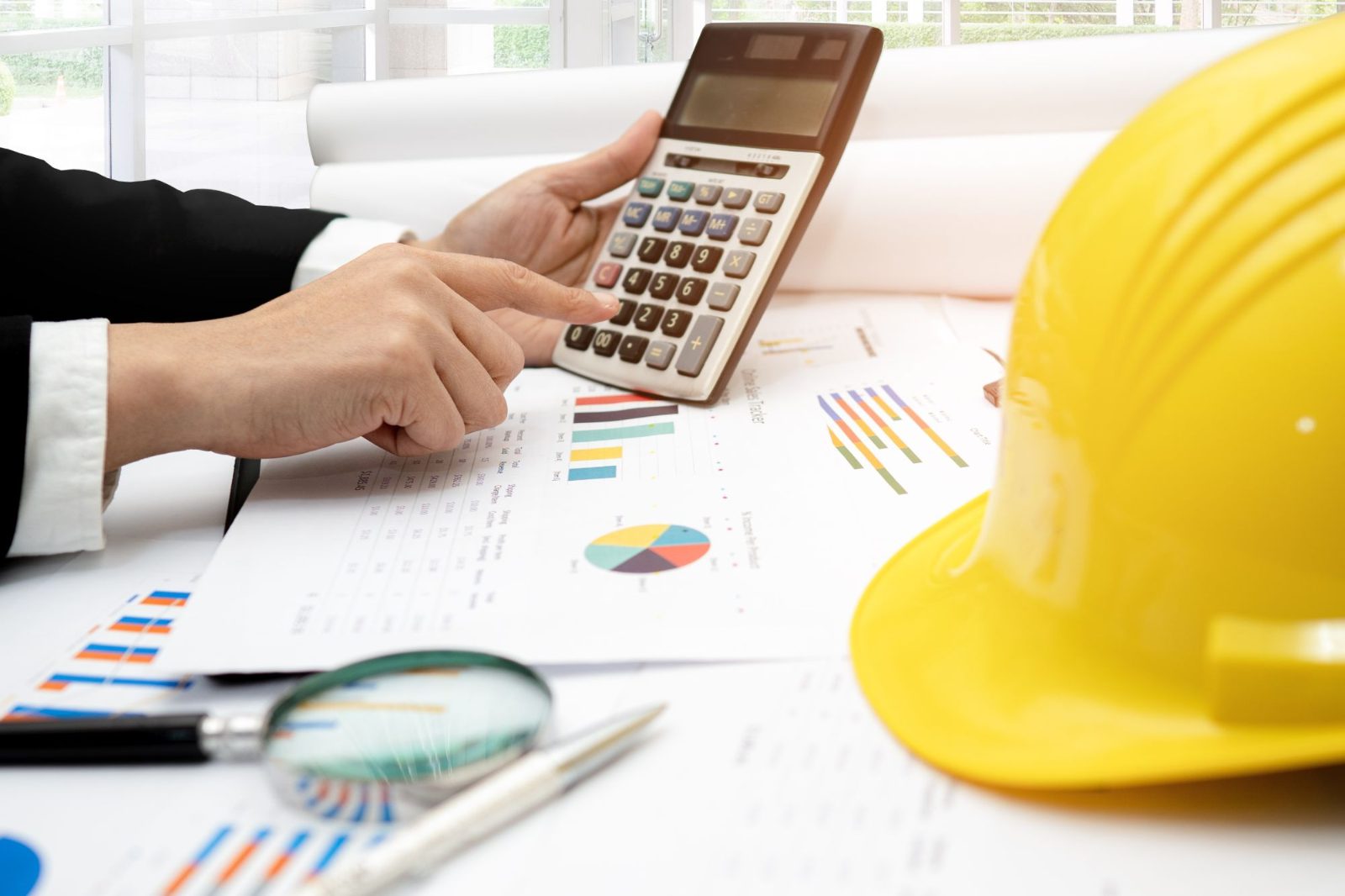 Calculator and hard hat for job costing