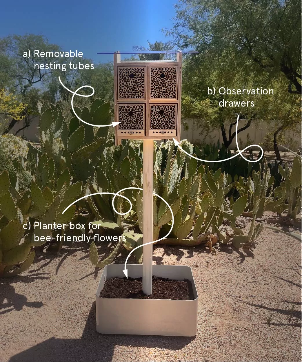 An Alvéole BeeHome with arrows pointing to the different elements including the removable nesting tubes, observation drawers, and planter box for flowers. wild bee hotels