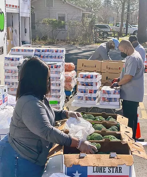 Target Hunger volunteers organize food for distribution. fight food insecurity