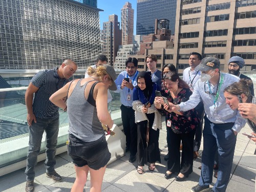 Tenants participating in a urban beekeeping guided experience.