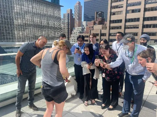 Tenants participating in a urban beekeeping guided experience.