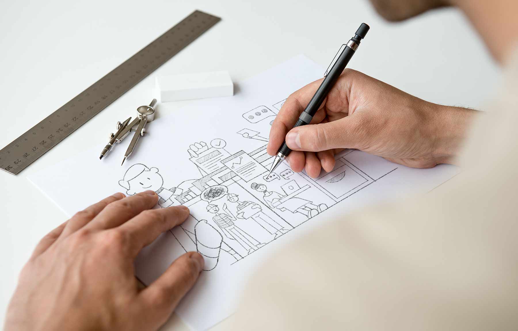 Project health Insight Brand image. Person drawing a detailed hand-sketched illustration of people and objects on white paper with a black pen, next to a metal ruler and a drawing compass.