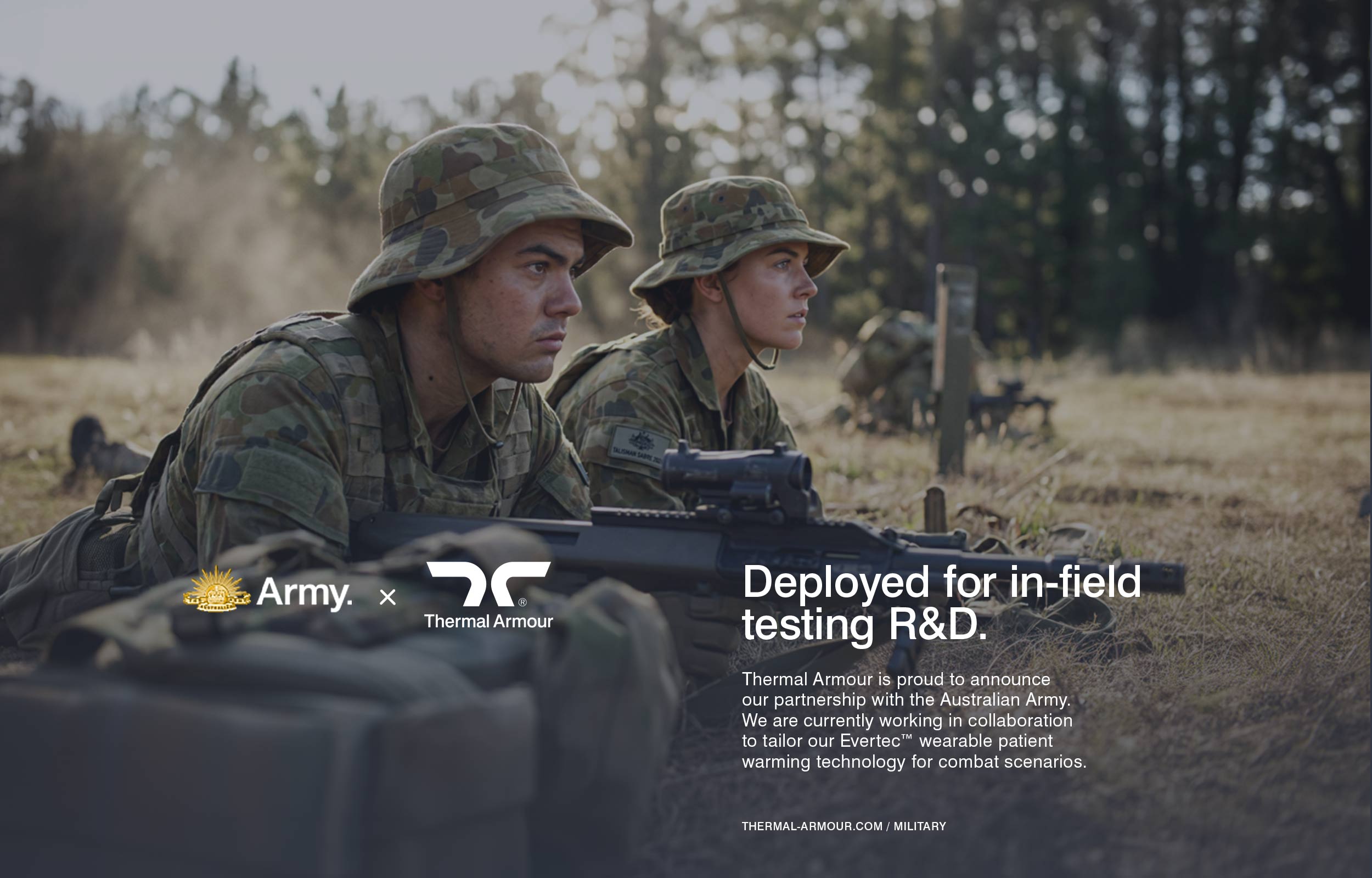 Thermal Armour x Australian Army. Two Australian soldiers in camouflage uniforms lie on the ground aiming rifles during a field exercise.
