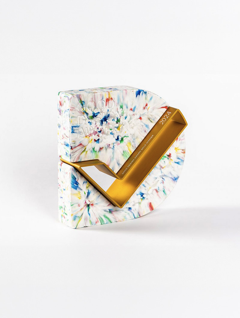 Good Design Award Gold. Colourful marbled award trophy shaped like a stylised checkmark with 2024 and Good Design Awards embossed.