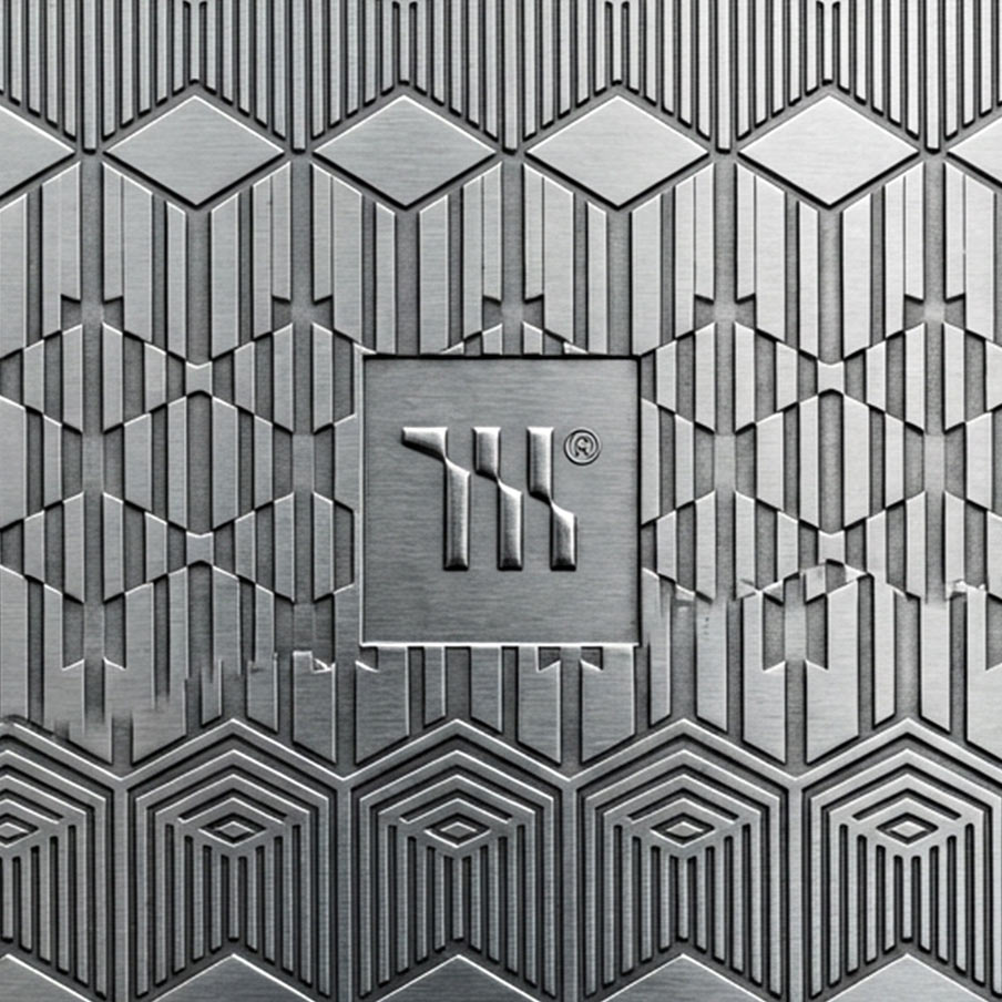 Mariachi Gold Coast Creative Studio Brand image. Patterned metal surface with geometric shapes and a central logo featuring stylized vertical lines in a square.