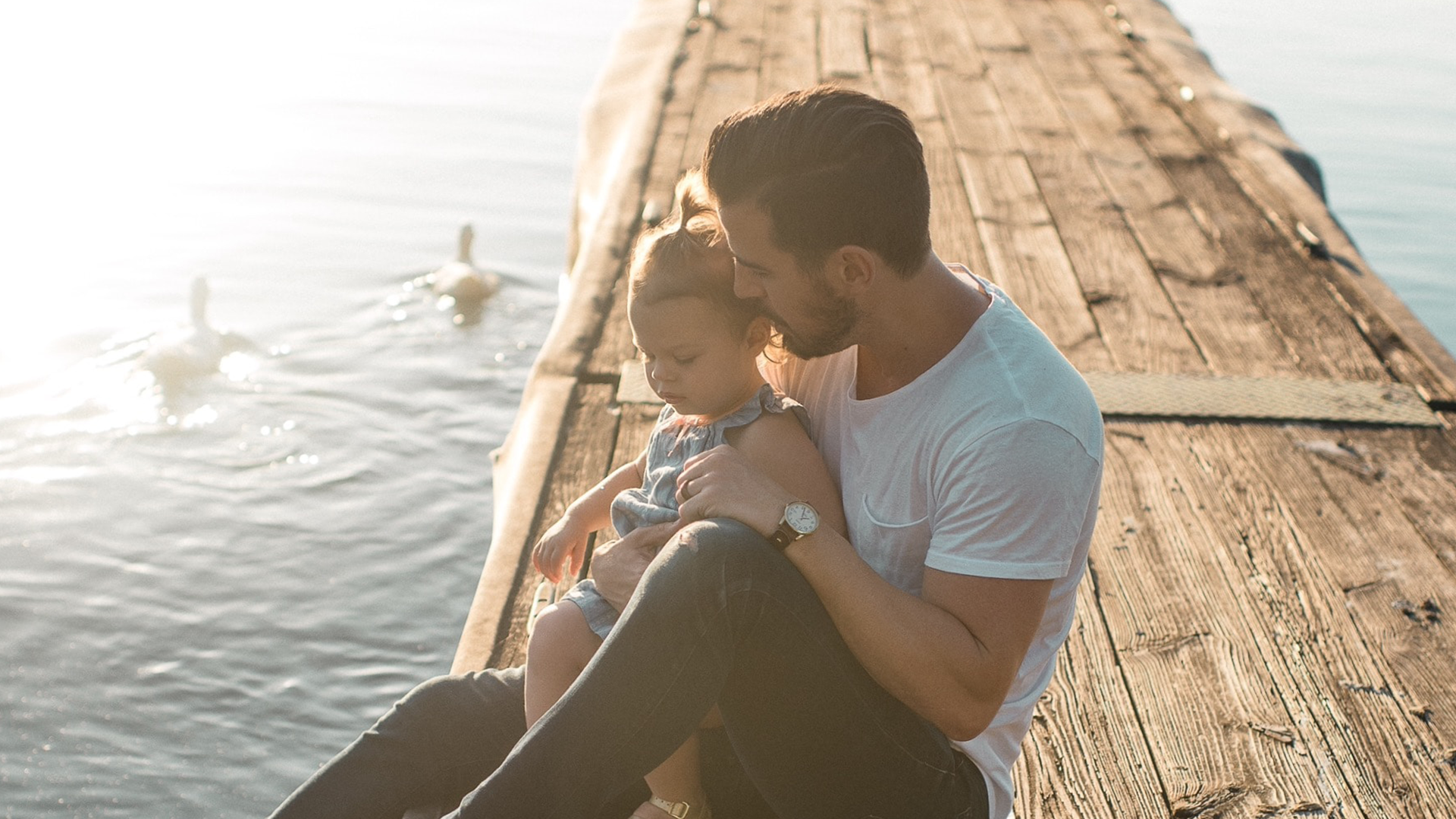 child, child welfare service, parents, father and son, father and daughter, water, sea, sun, hug, embrace