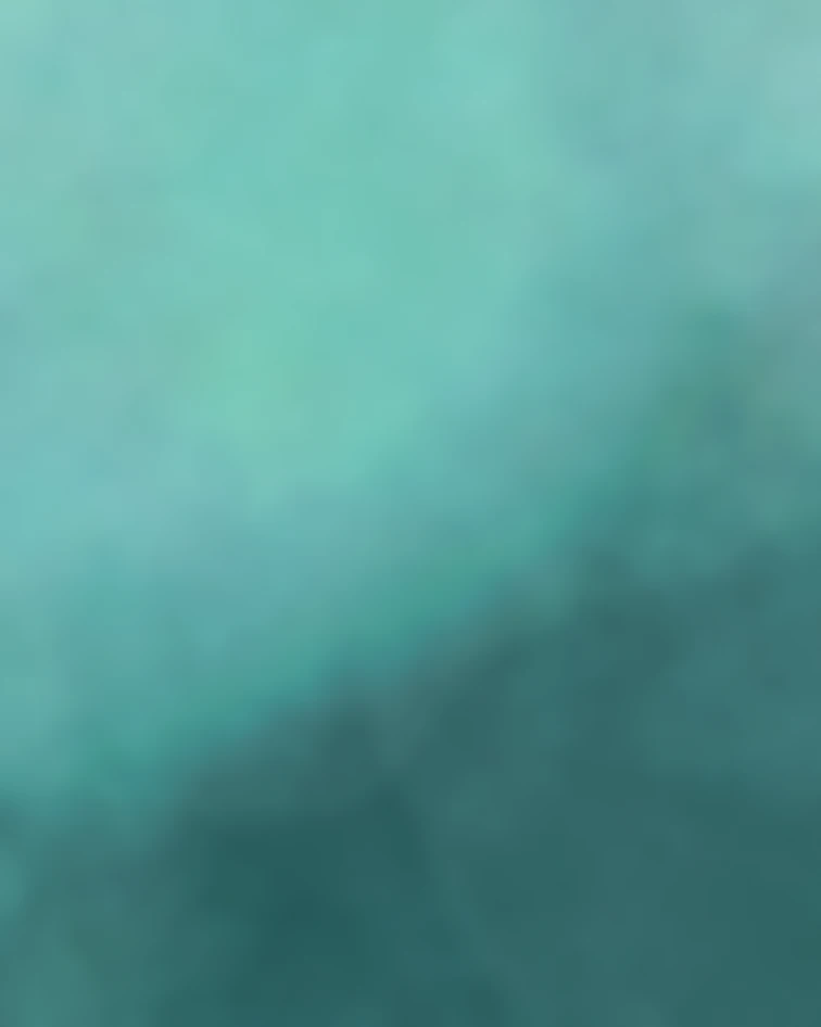 Abstract teal and turquoise gradient background with soft blurred textures.